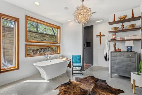 a open kitchen with stainless steel appliances granite countertop a stove and a refrigerator