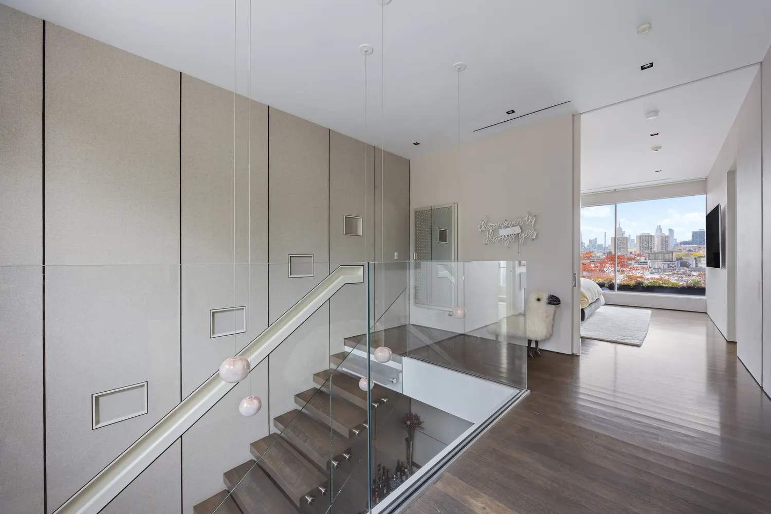 a view of living room with furniture and wooden floor
