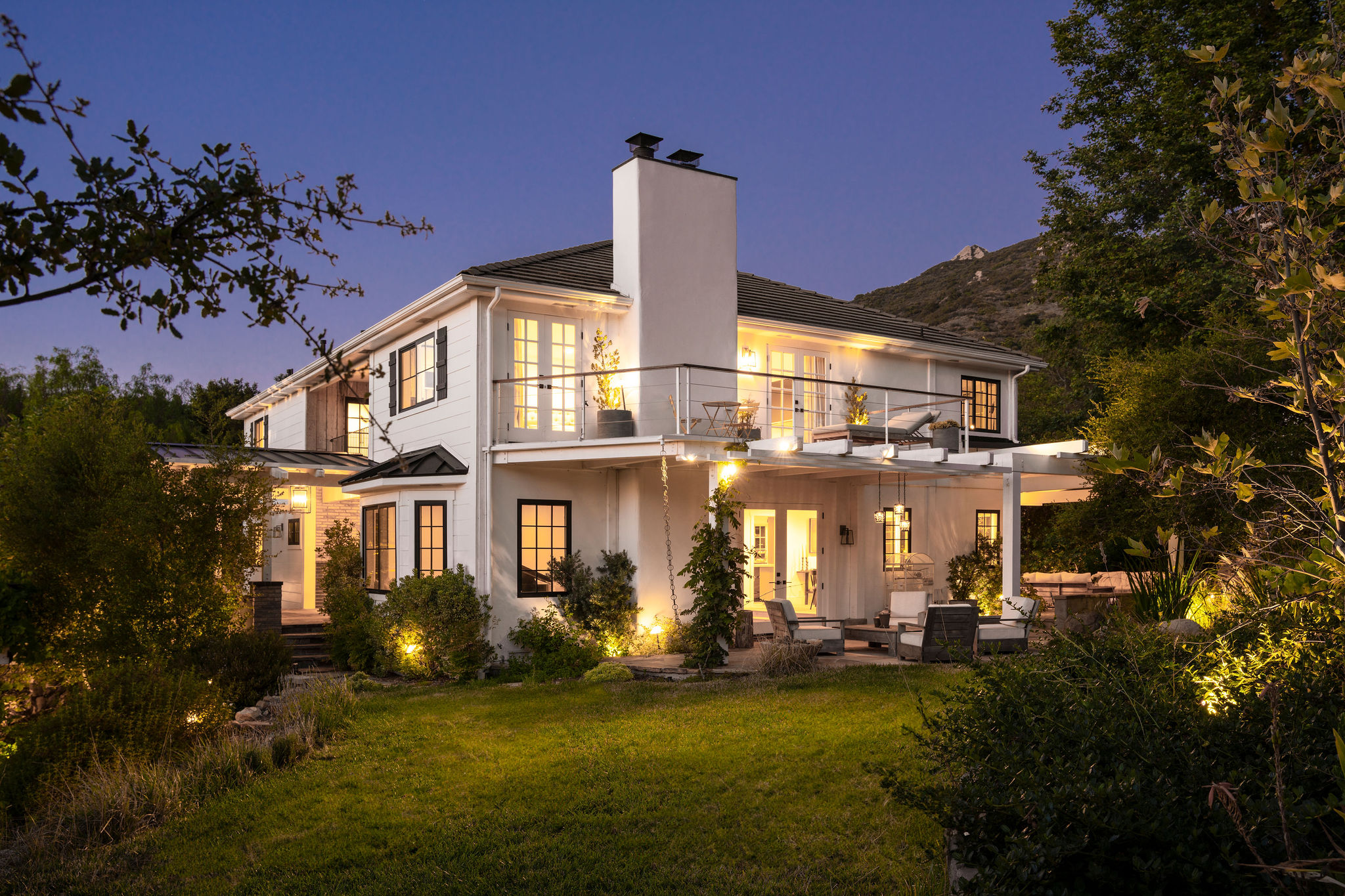 560 Cold Canyon Road Calabasas, CA 91302 - Photo 3 of 84 a front view of a house with a garden