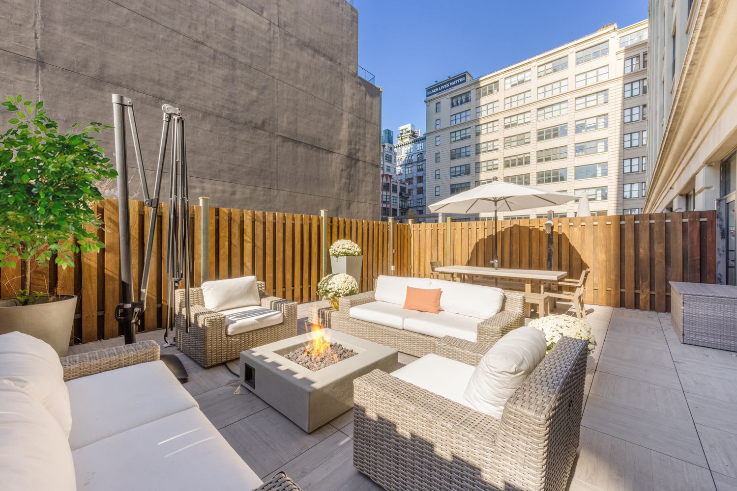 a view of a patio with couches and potted plants