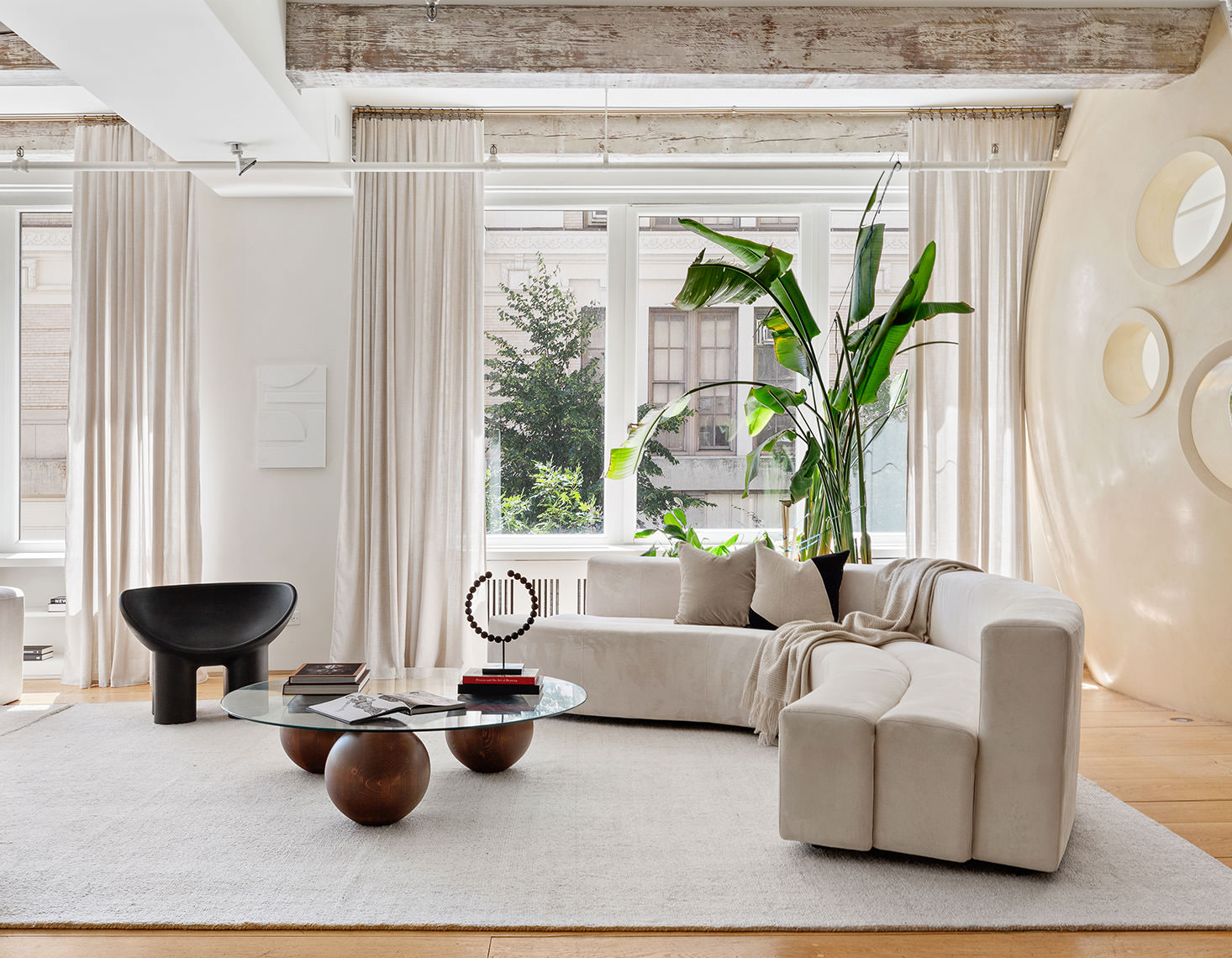 145 6th Avenue, Unit 2B Manhattan, NY 10013 - Photo 12 of 23 a living room with furniture and a potted plant