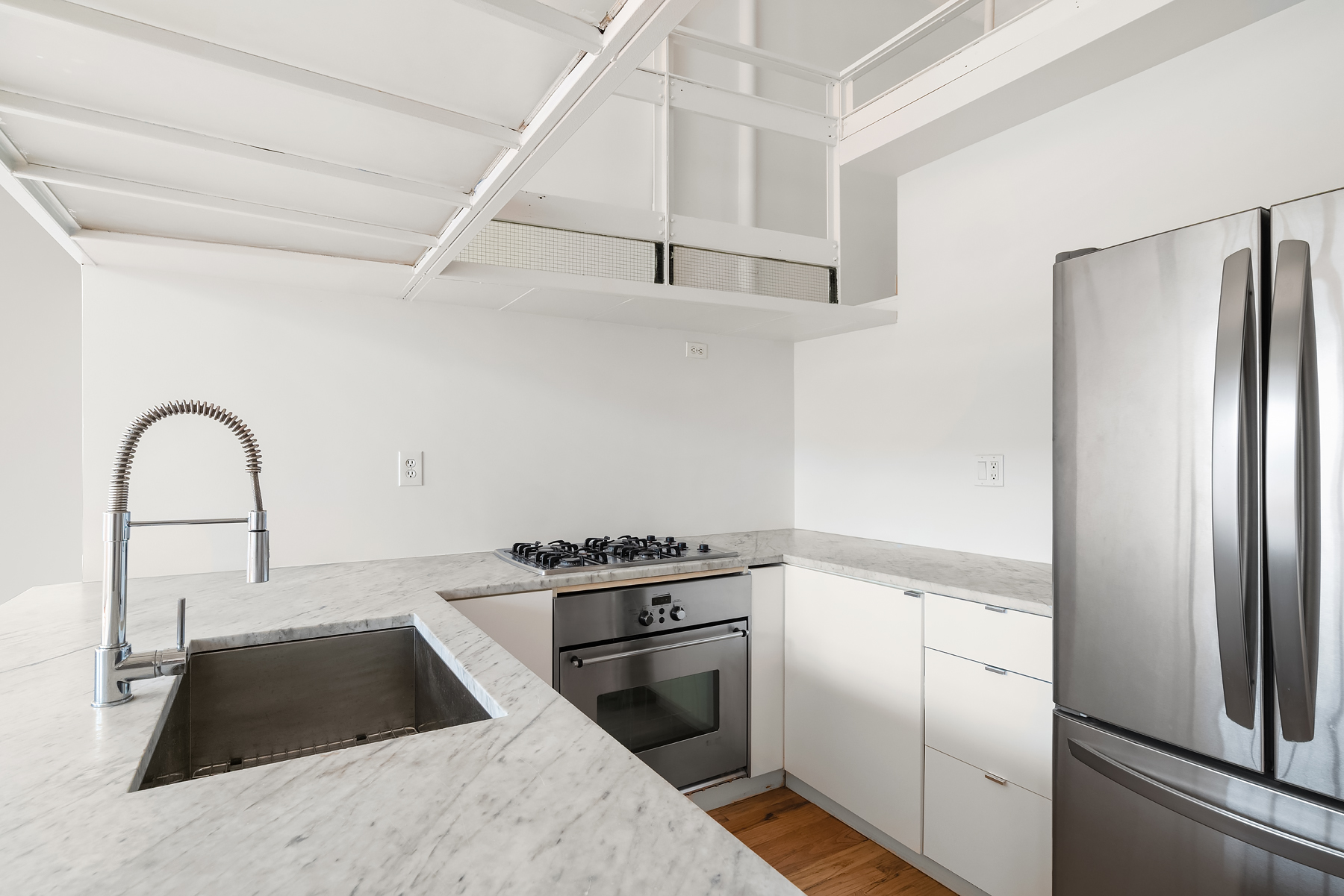 689 Myrtle Avenue, Unit 4E Brooklyn, NY 11205 - Photo 8 of 21 a kitchen with a refrigerator stove and a sink