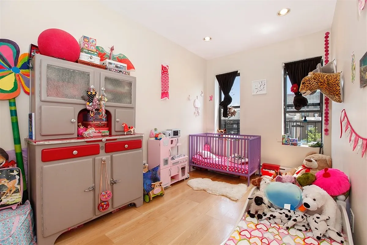 230 Frost Street Brooklyn, NY 11211 - Photo 5 of 17 a bedroom with furniture and a bed