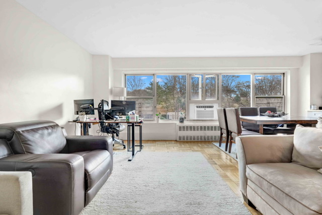 135 Ashland Place, Unit 5A Brooklyn, NY 11201 - Photo 1 of 12 a living room with furniture and a large window