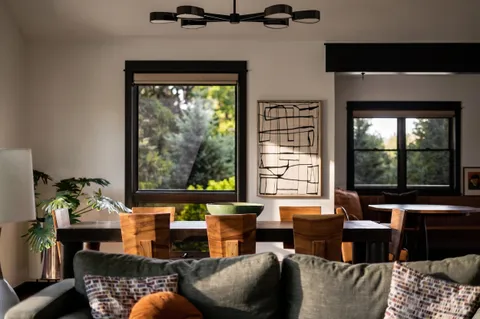 a view of a dining room with furniture window and wooden floor