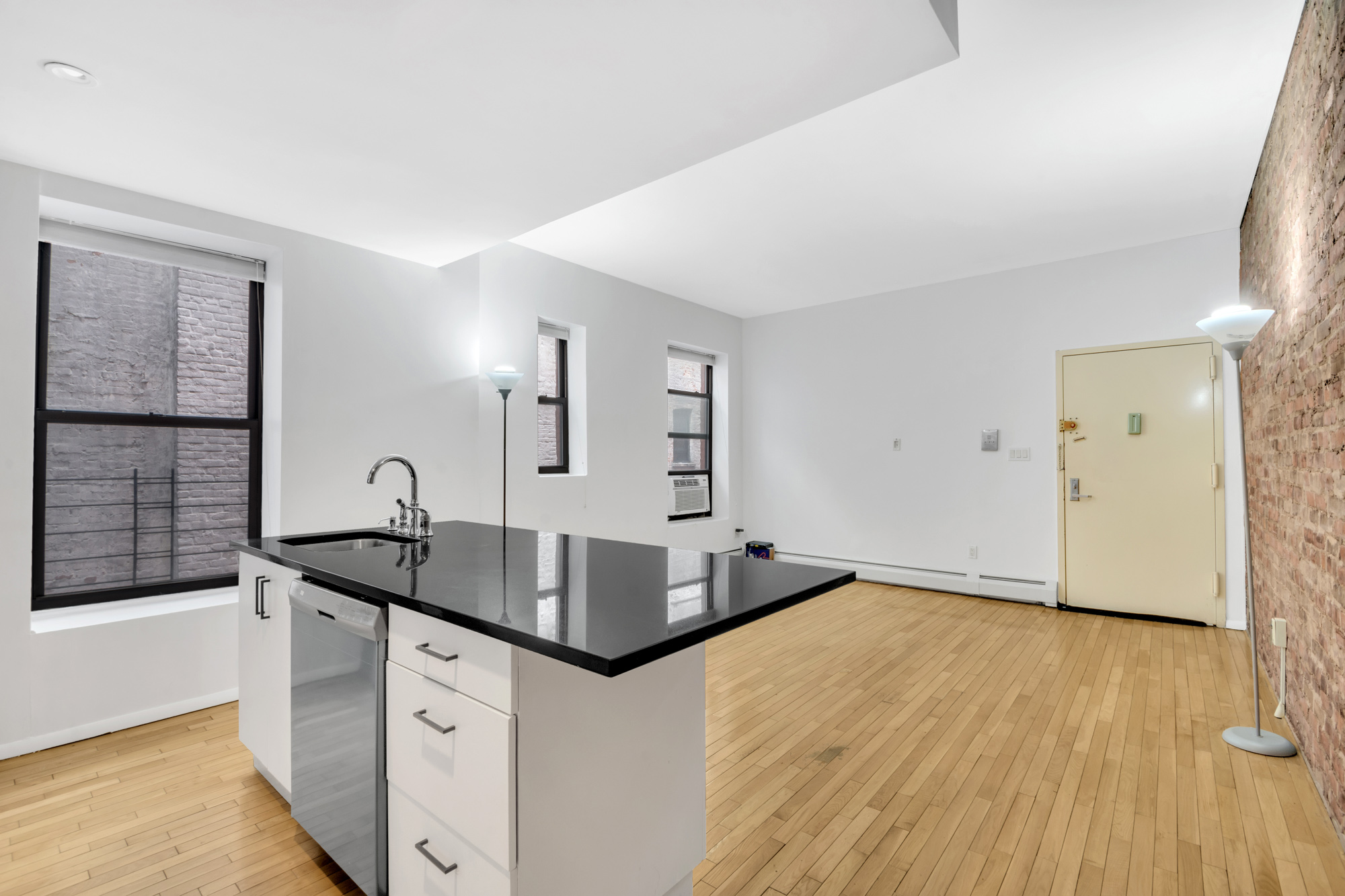 277 Nostrand Avenue, Unit 3A Brooklyn, NY 11216 - Photo 4 of 10 a kitchen with granite countertop a sink and granite counter tops
