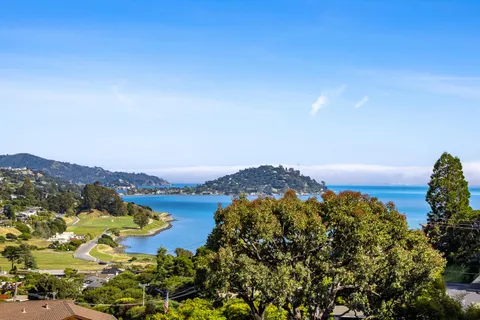 an aerial view of mountain with lake view