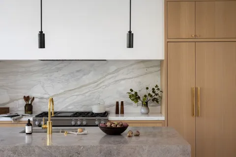 a kitchen with a stove and a window