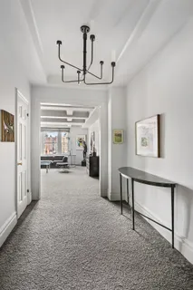 a view of a livingroom with furniture and a ceiling fan