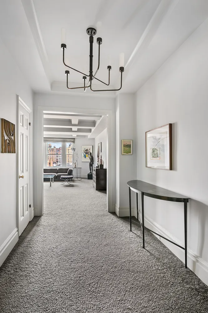 a view of a livingroom with furniture and a ceiling fan