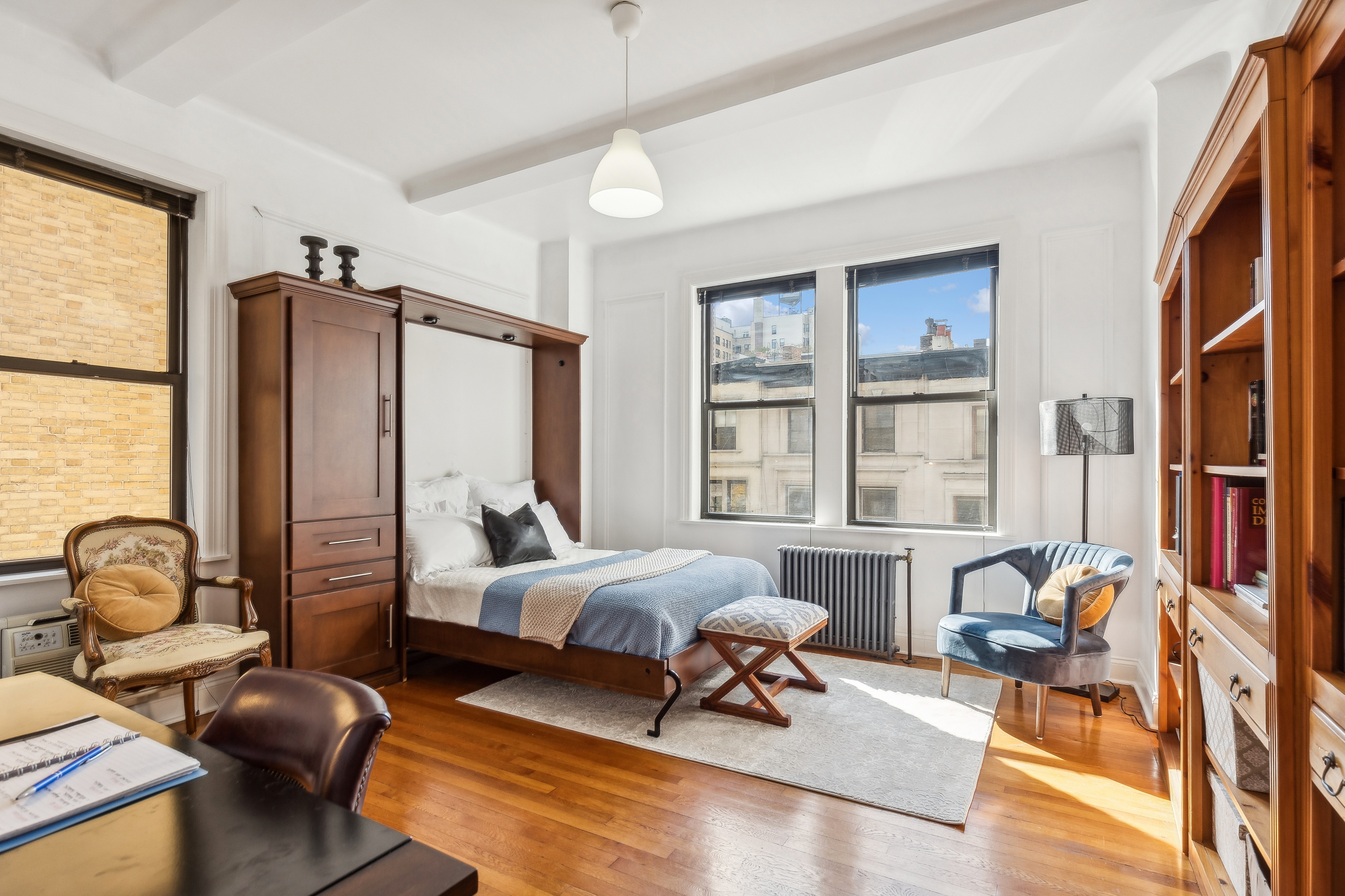 300 Riverside Drive, Unit 5E Manhattan, NY 10025 - Photo 10 of 11 a living room with furniture rug and a window