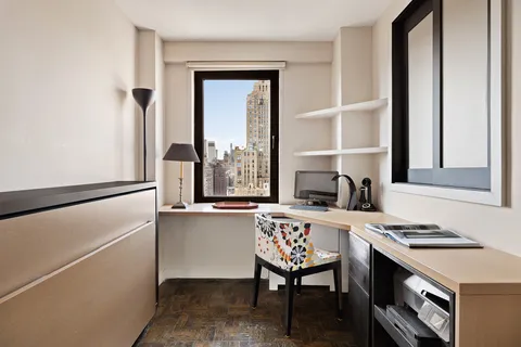 a kitchen with a stove a sink and a refrigerator