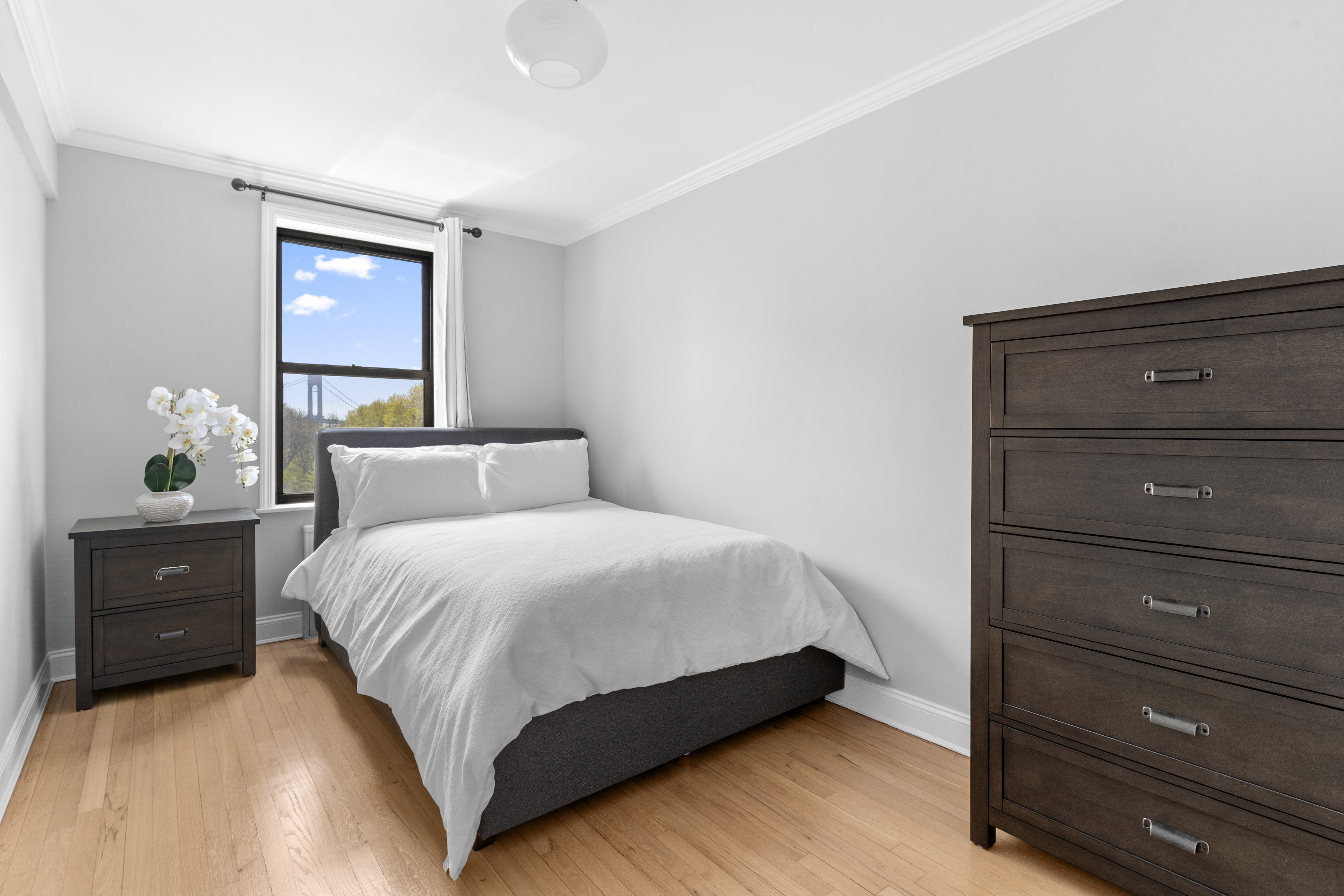 20 89th Street, Unit 5C Brooklyn, NY 11209 - Photo 7 of 10 a bedroom with a bed and a window