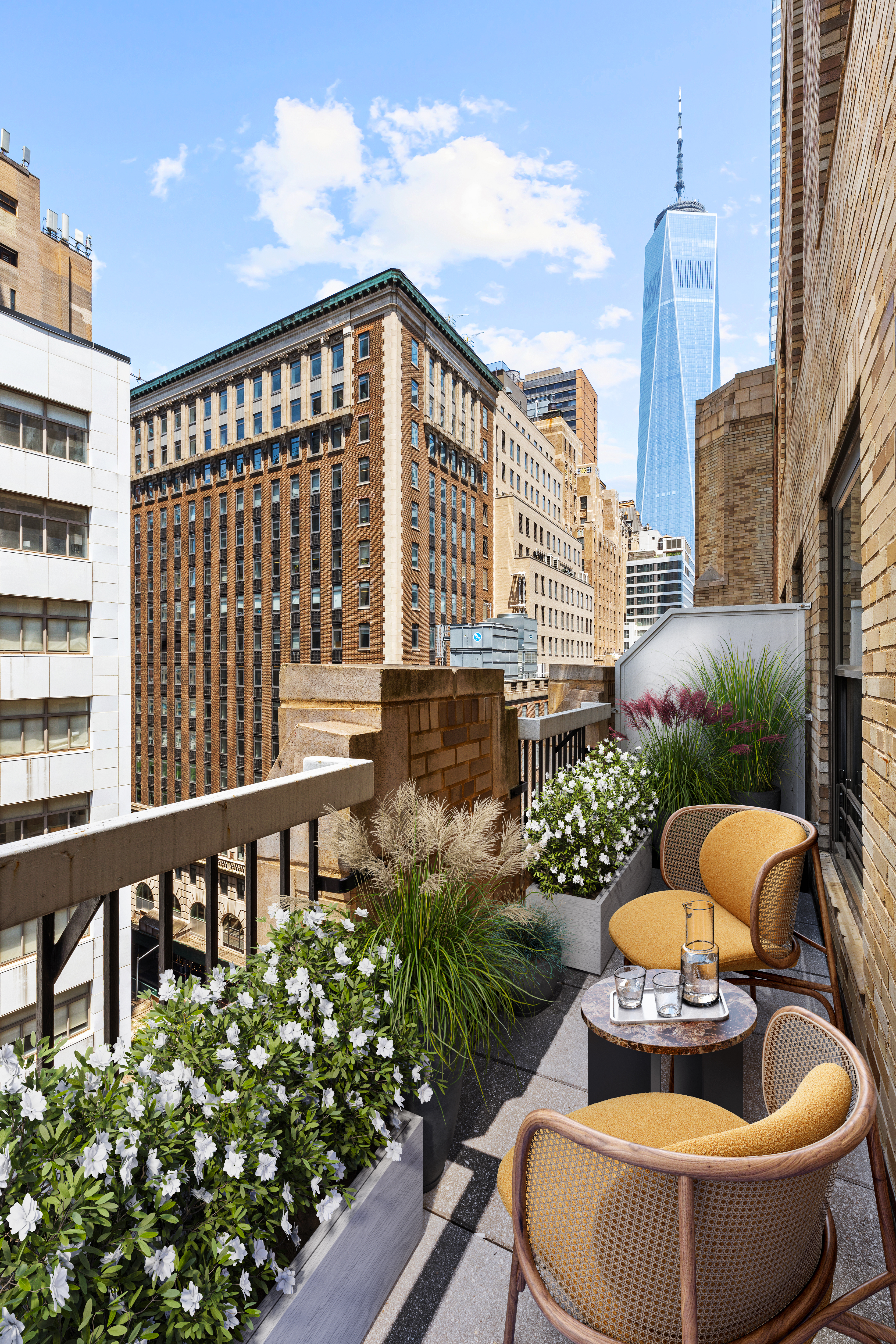 88 Greenwich Street, Unit 920 Manhattan, NY 10006 - Photo 1 of 17 a view of a chairs and table in the balcony