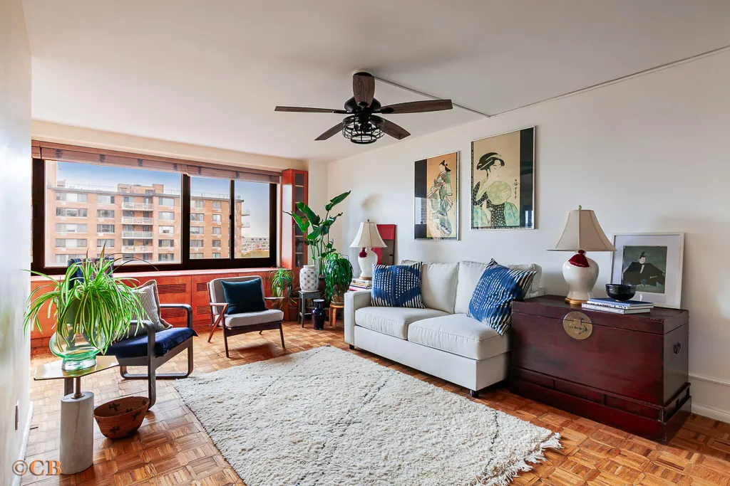 a living room with furniture and a large window