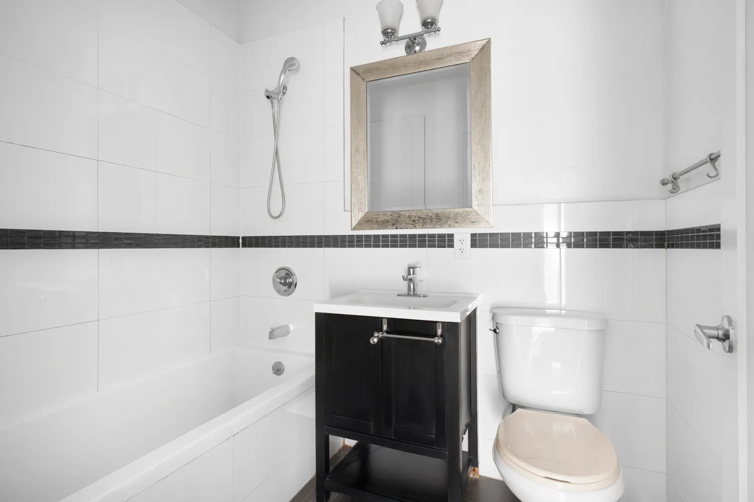 a bathroom with a sink a toilet and bathtub