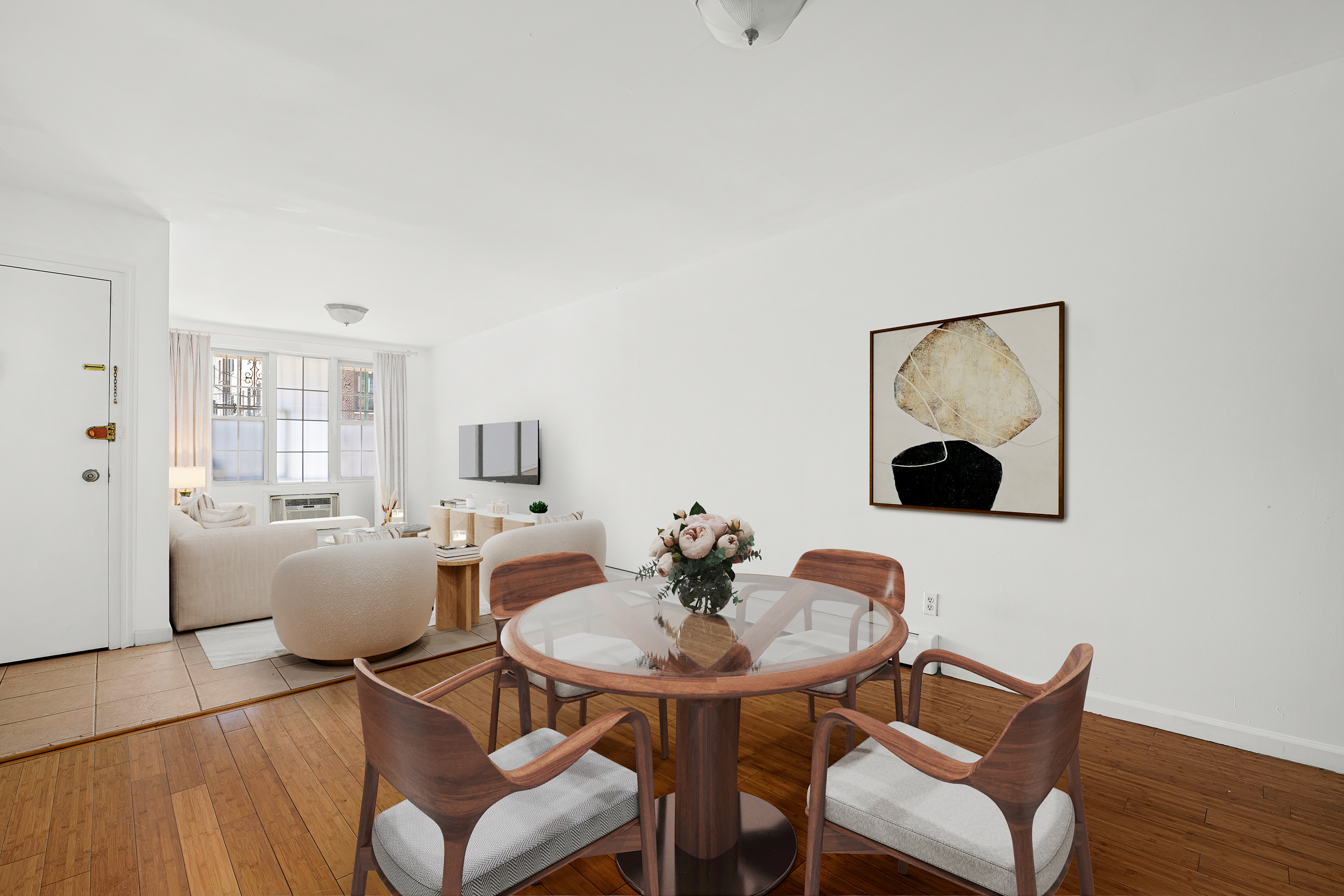 a dining room with furniture and wooden floor
