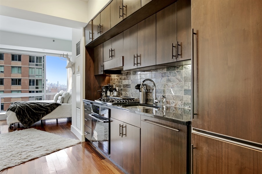 150 Myrtle Avenue, Unit 1902 Brooklyn, NY 11201 - Photo 3 of 27 a kitchen with stainless steel appliances granite countertop a stove and a sink