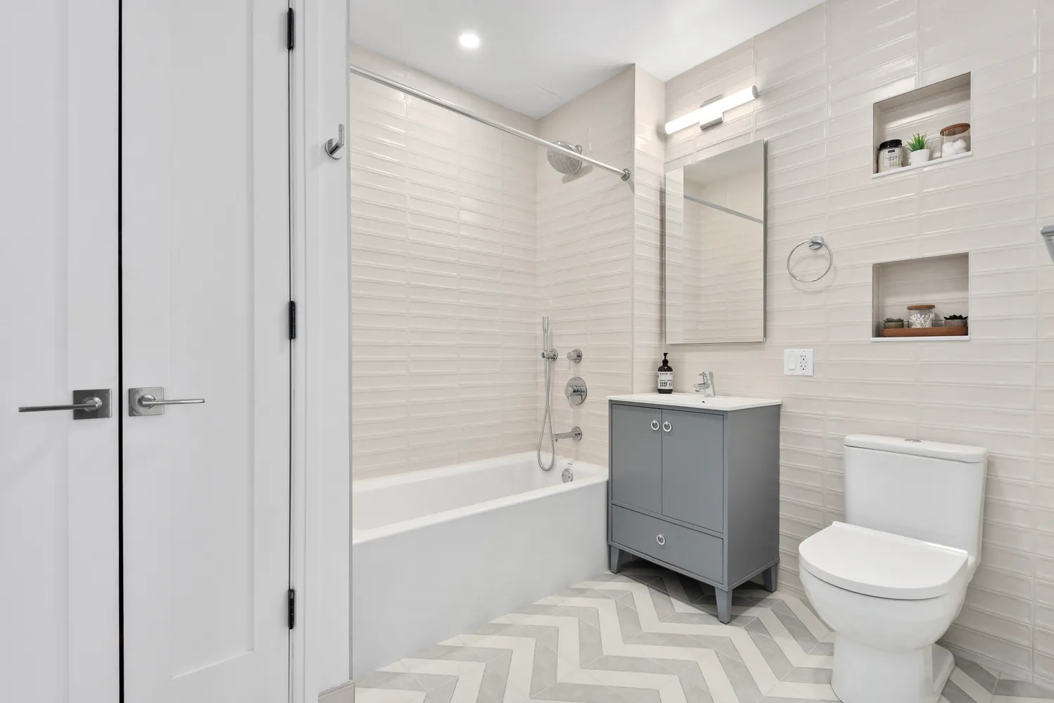 a bathroom with a toilet a sink and bathtub