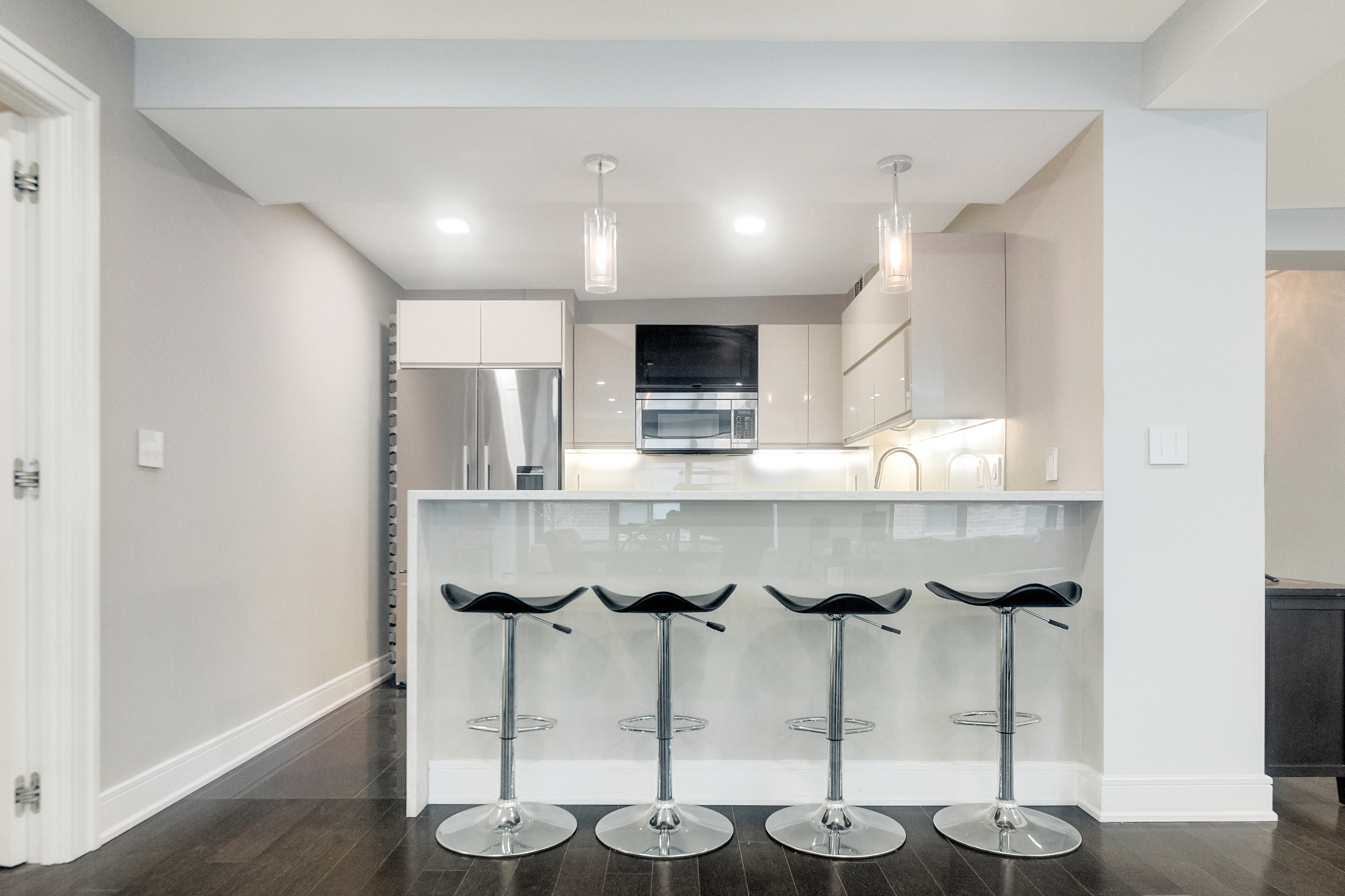 2 Tudor City Place, Unit 12DS Manhattan, NY 10017 - Photo 6 of 20 a kitchen with stainless steel appliances kitchen island granite countertop a table and chair
