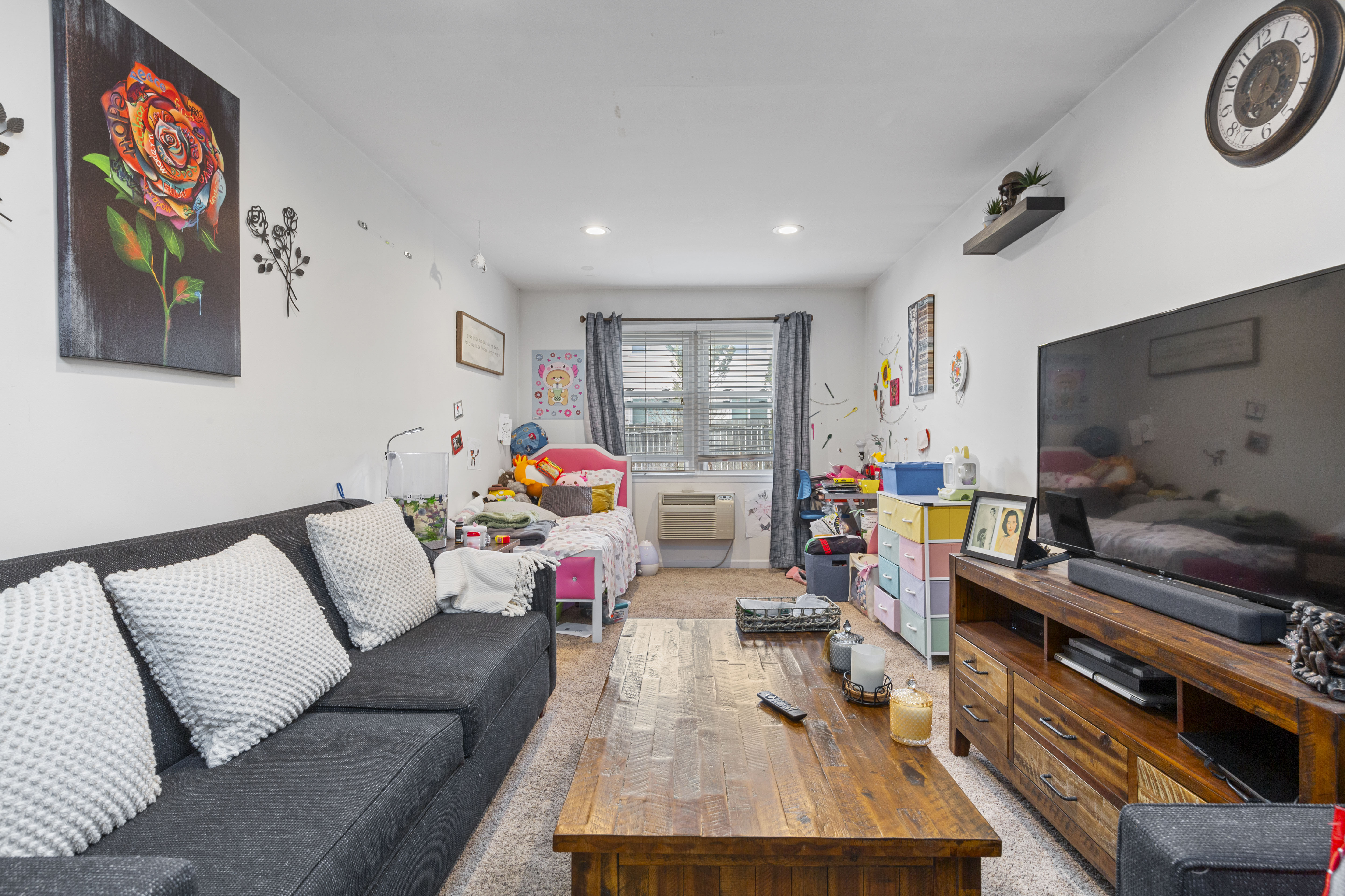 240-47 68th Avenue Queens, NY 11362 - Photo 5 of 39 a living room with furniture and a flat screen tv