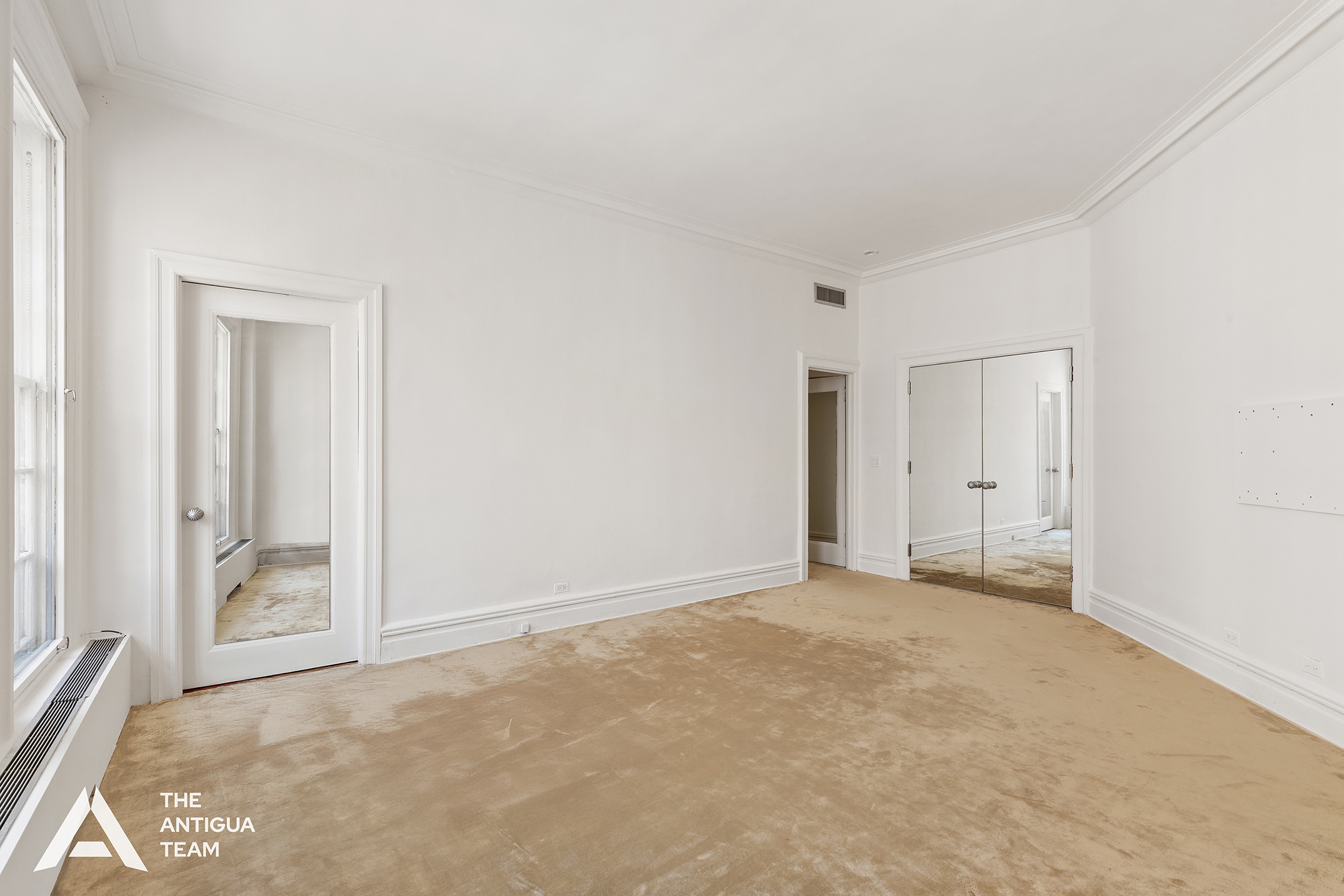 45 East 66th Street, Unit 4W Manhattan, NY 10065 - Photo 12 of 27 an empty room with an entryway