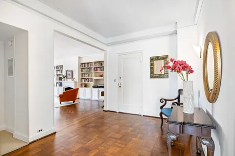 a view of living room with furniture and a chandelier