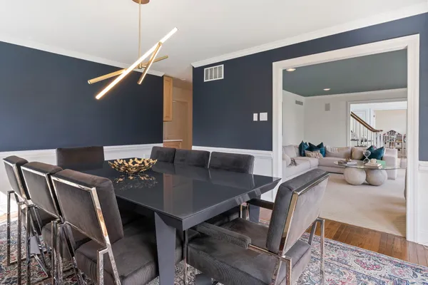 a large kitchen with a large window and stainless steel appliances