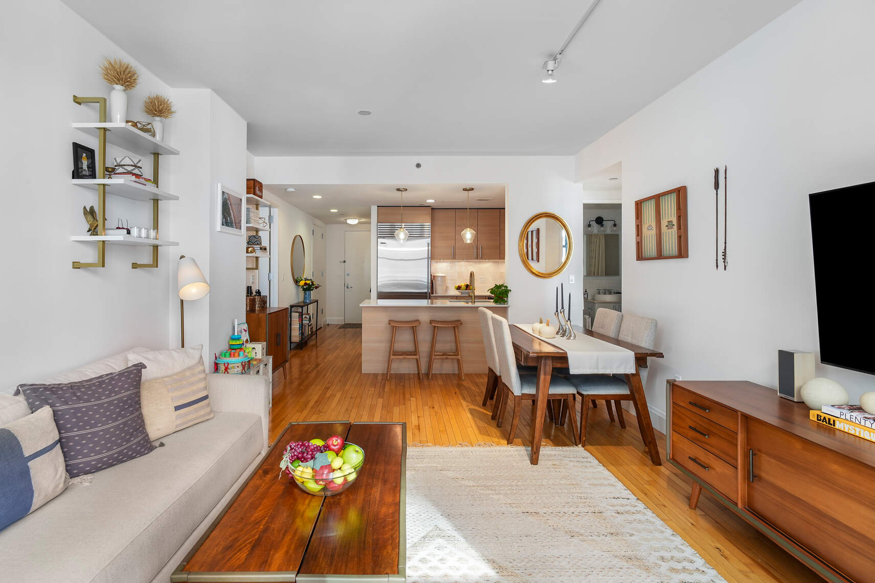 199 State Street, Unit 5C Brooklyn, NY 11201 - Photo 3 of 16 a living room with furniture and a flat screen tv