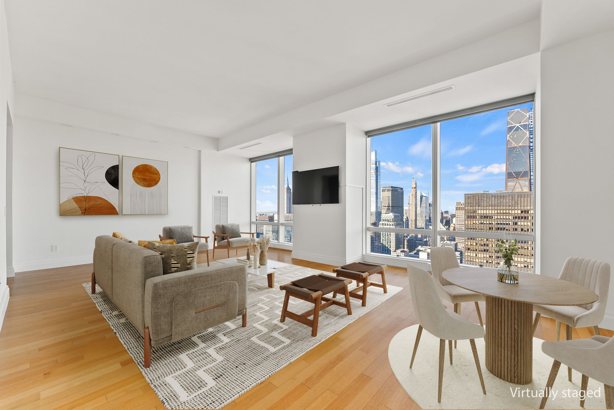 845 United Nations Plaza, Unit 63D Manhattan, NY 10017 - Photo 3 of 16 a living room with furniture and flat screen tv