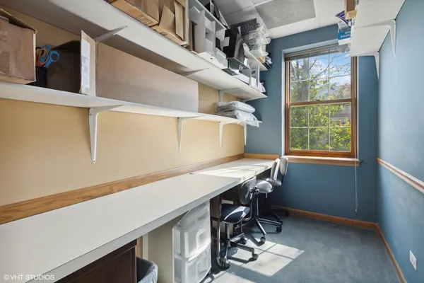 a view of a workspace with furniture