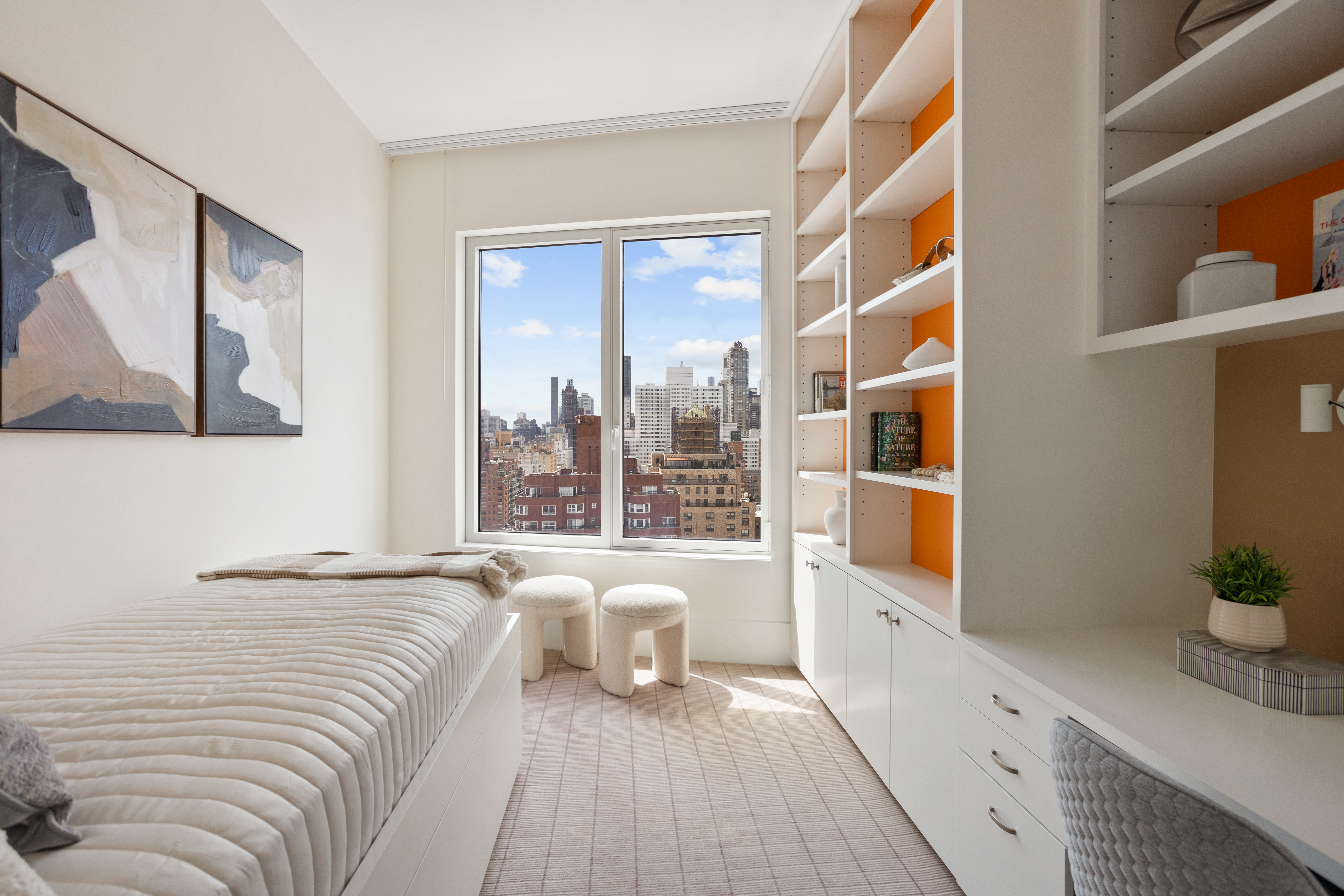 255 East 74th Street, Unit 21B Manhattan, NY 10021 - Photo 20 of 40 a bedroom with a bed and a large window with outer view