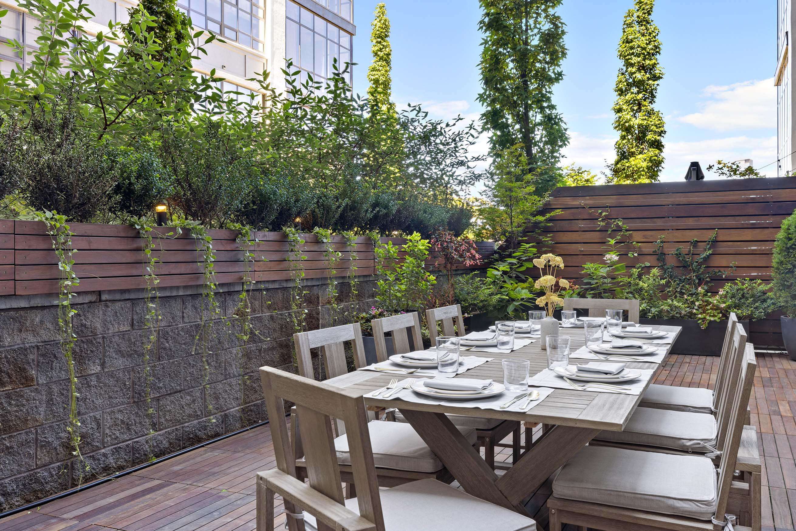 360 Furman Street, Unit 320/321 Brooklyn, NY 11201 - Photo 7 of 28 a view of a patio with table and chairs and potted plants
