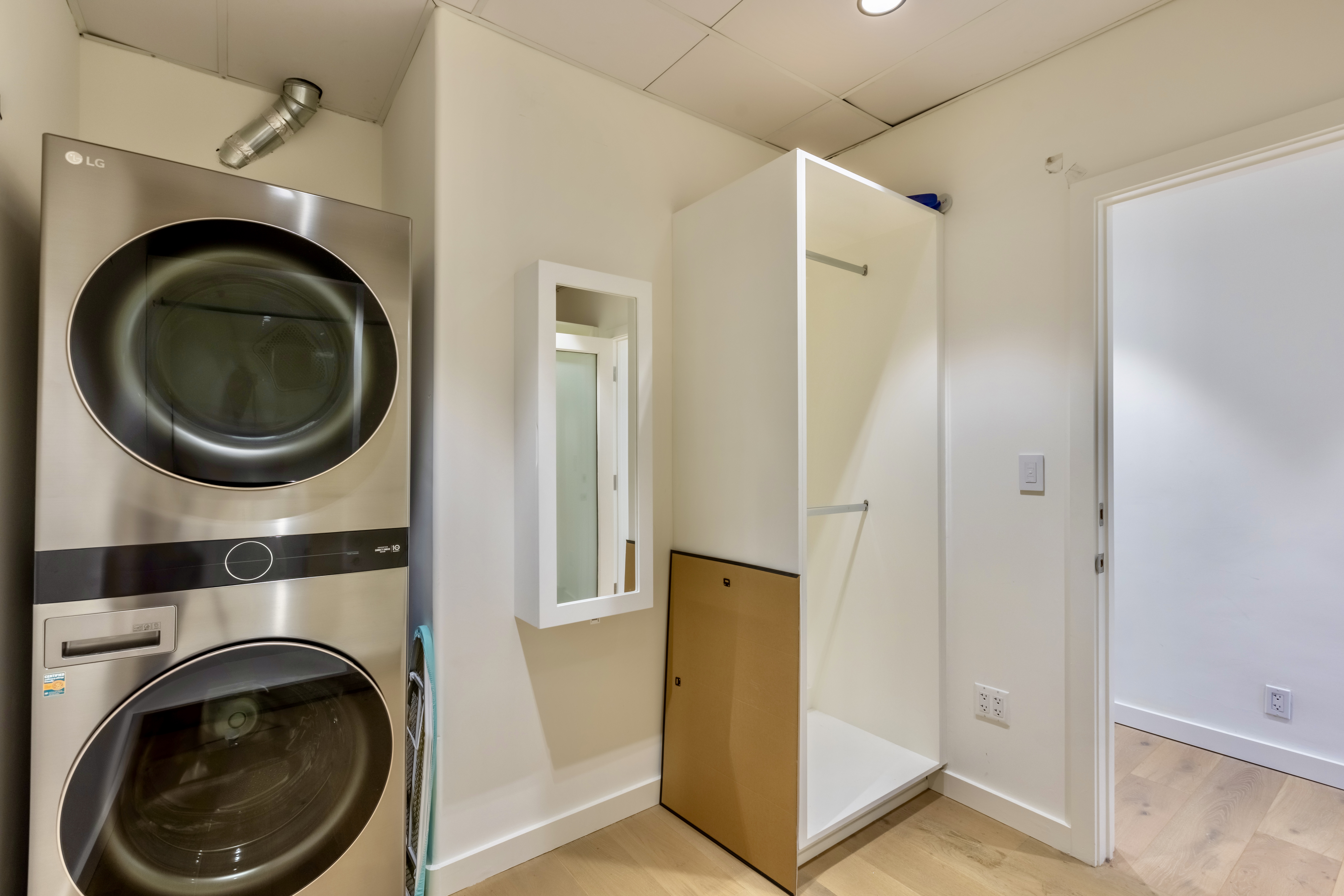 3058 North Lima Street Burbank, CA 91504 - Photo 33 of 41 a view of a hallway with washer and dryer
