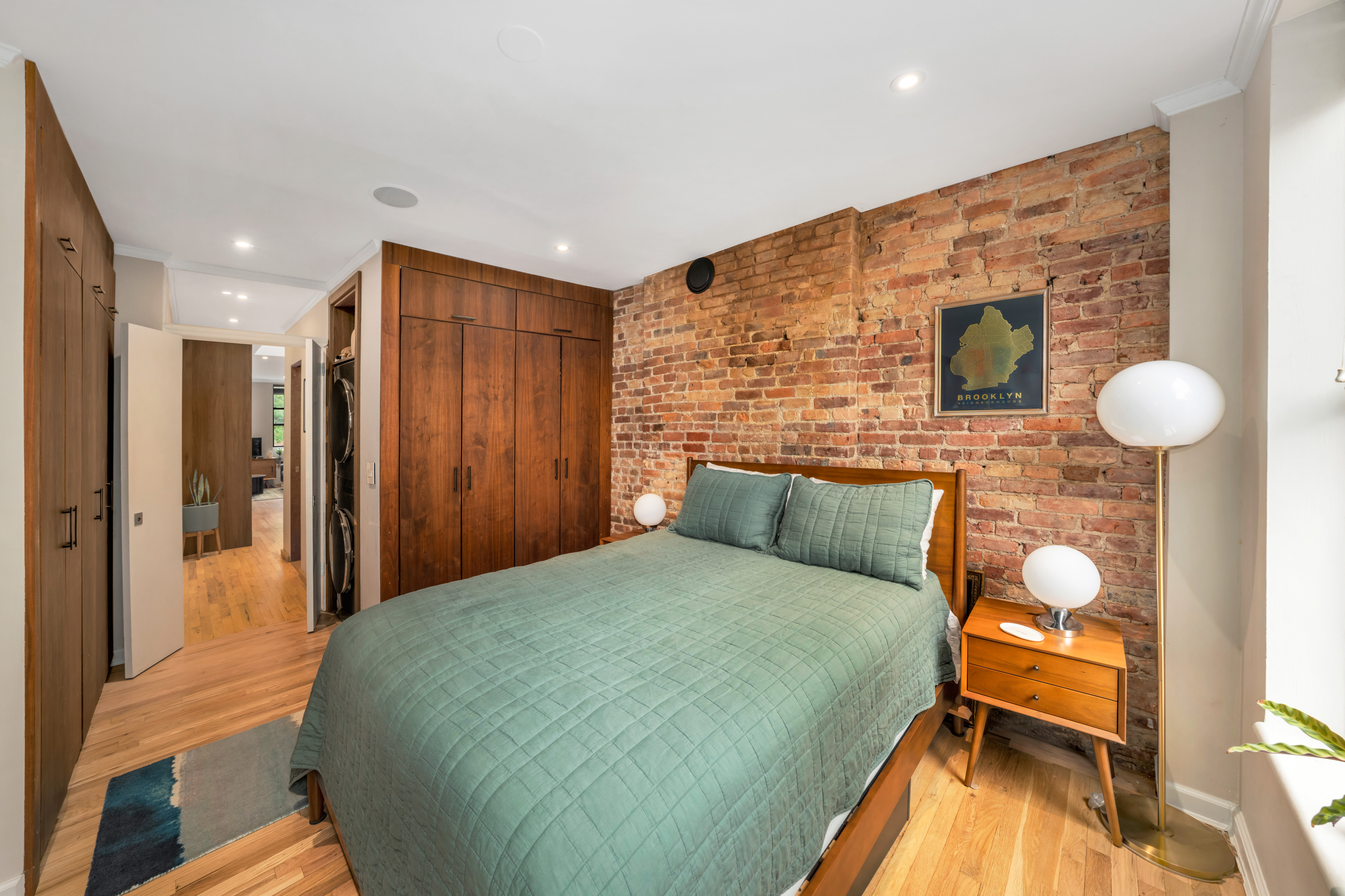 535 Clinton Street, Unit 4A Brooklyn, NY 11231 - Photo 9 of 10 a bedroom with a bed and a table