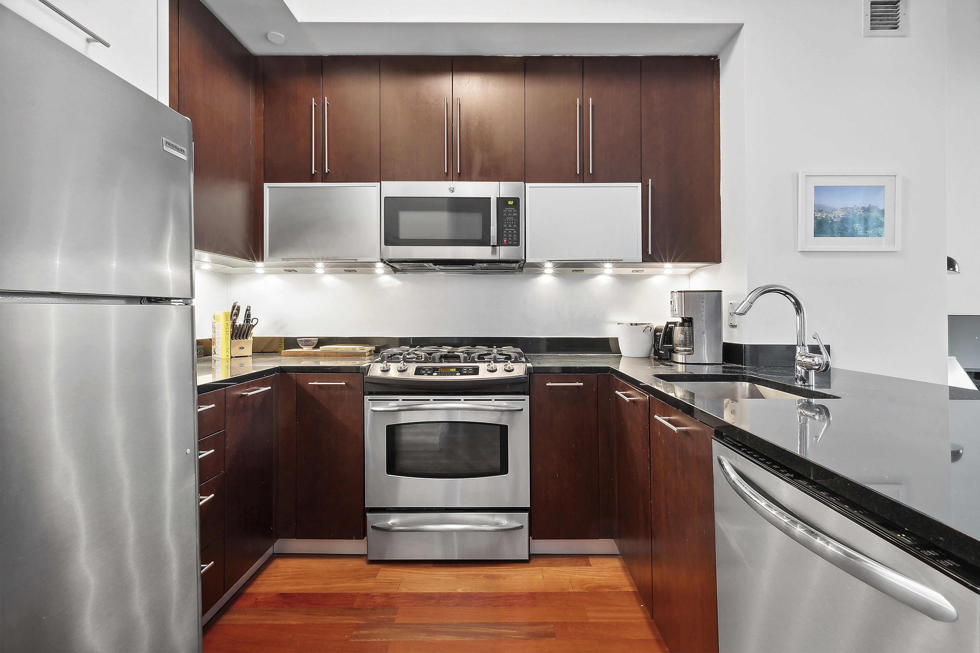 100 Jay Street, Unit 26B Brooklyn, NY 11201 - Photo 7 of 15 a kitchen with a refrigerator sink and stove
