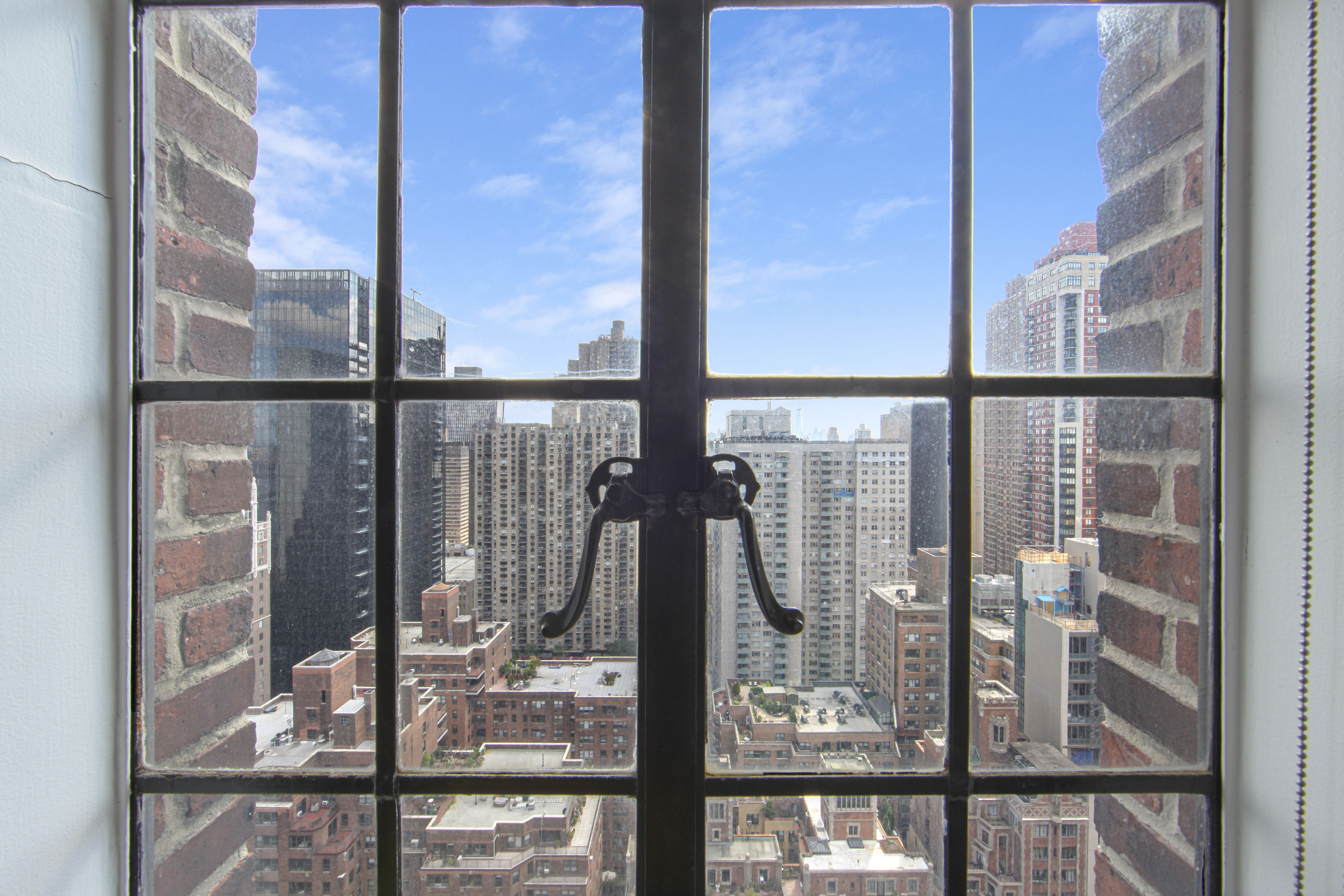 320 East 42nd Street, Unit 3012 Manhattan, NY 10017 - Photo 5 of 12 a view of ocean from a window
