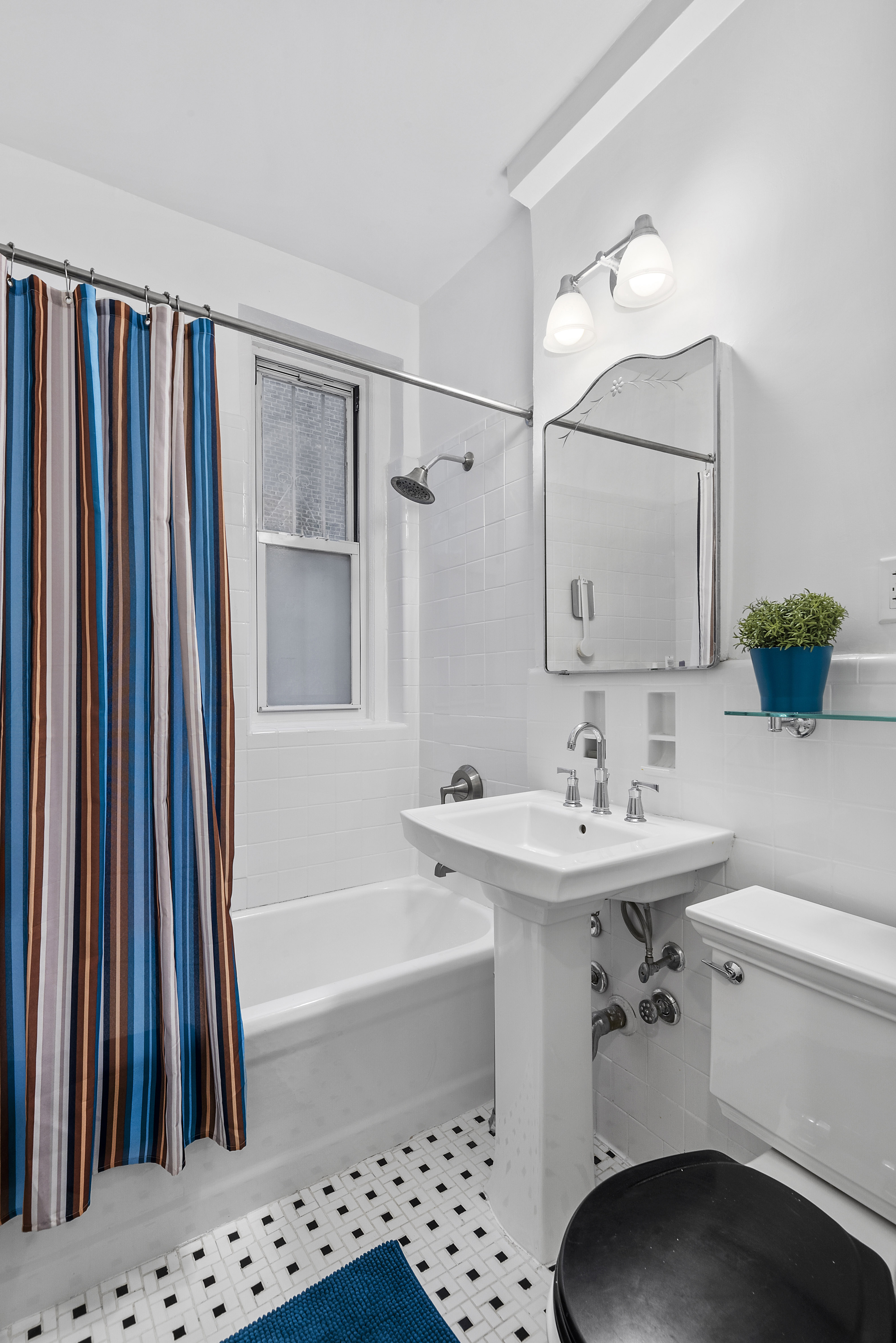 1409 Albemarle Road, Unit 1H Brooklyn, NY 11226 - Photo 7 of 9 a bathroom with a sink a toilet and shower