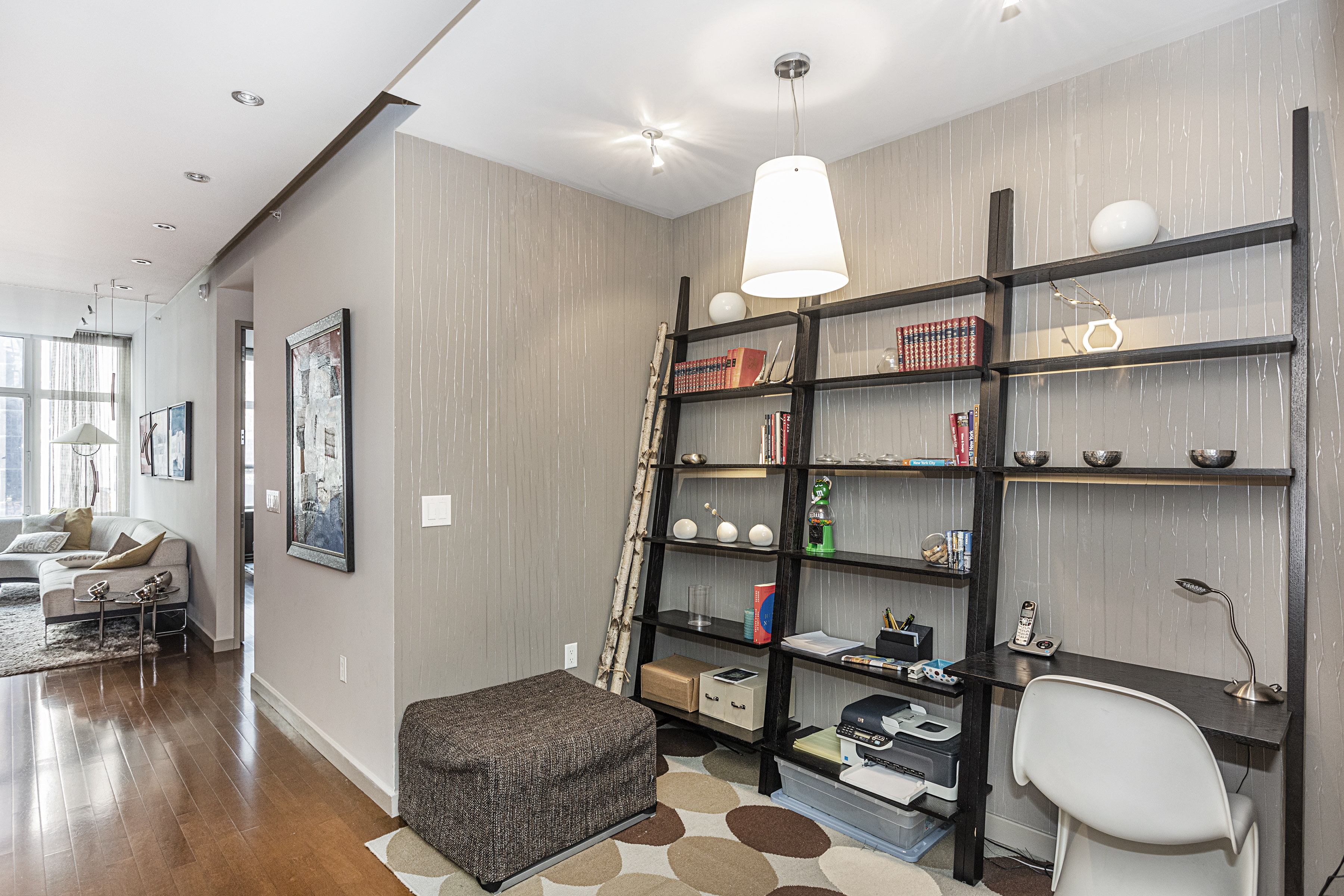 1600 Broadway, Unit 18G Manhattan, NY 10019 - Photo 4 of 10 a view of a livingroom with furniture and wooden floor