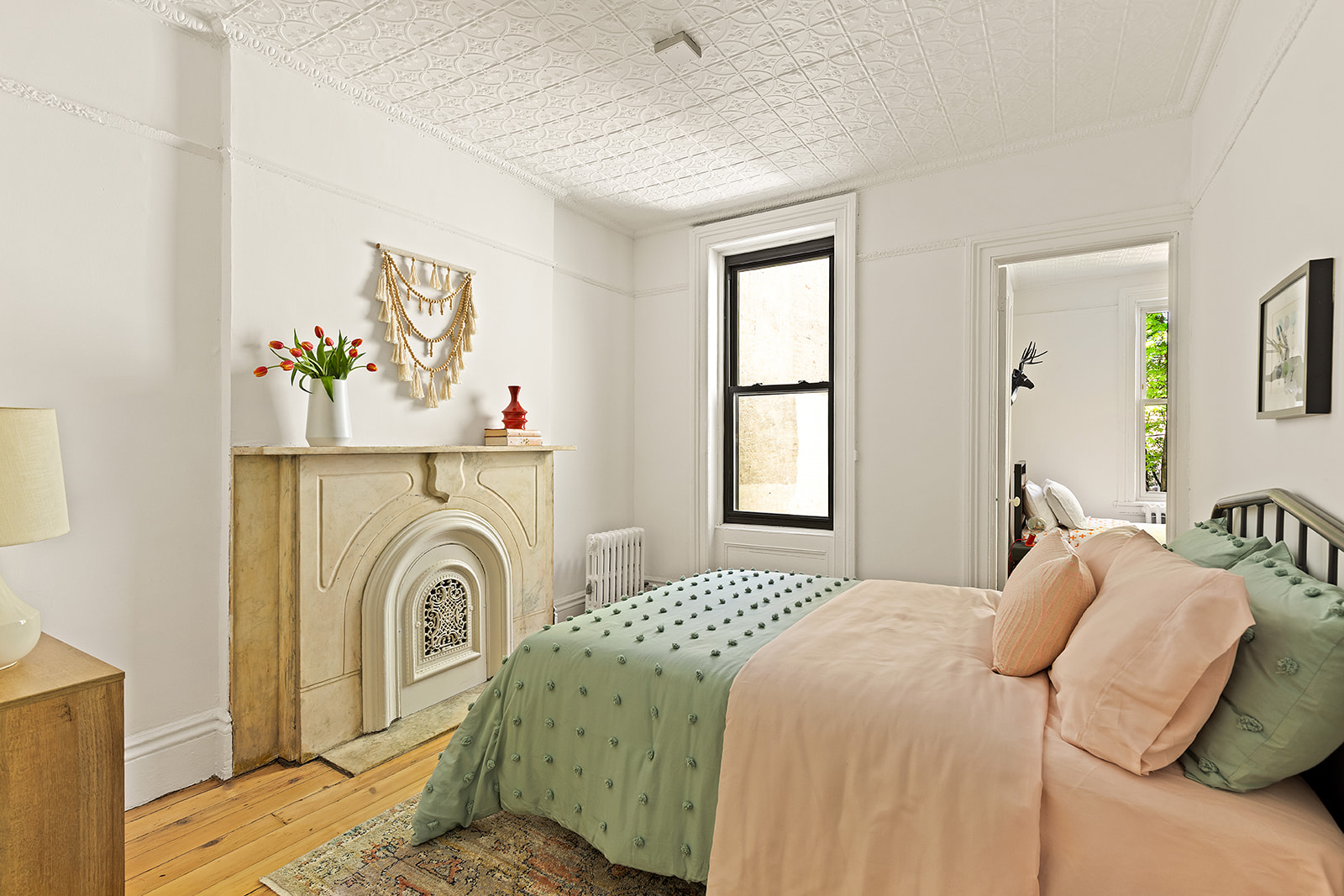 467 11th Street Brooklyn, NY 11215 - Photo 8 of 14 a bedroom with a bed and a window
