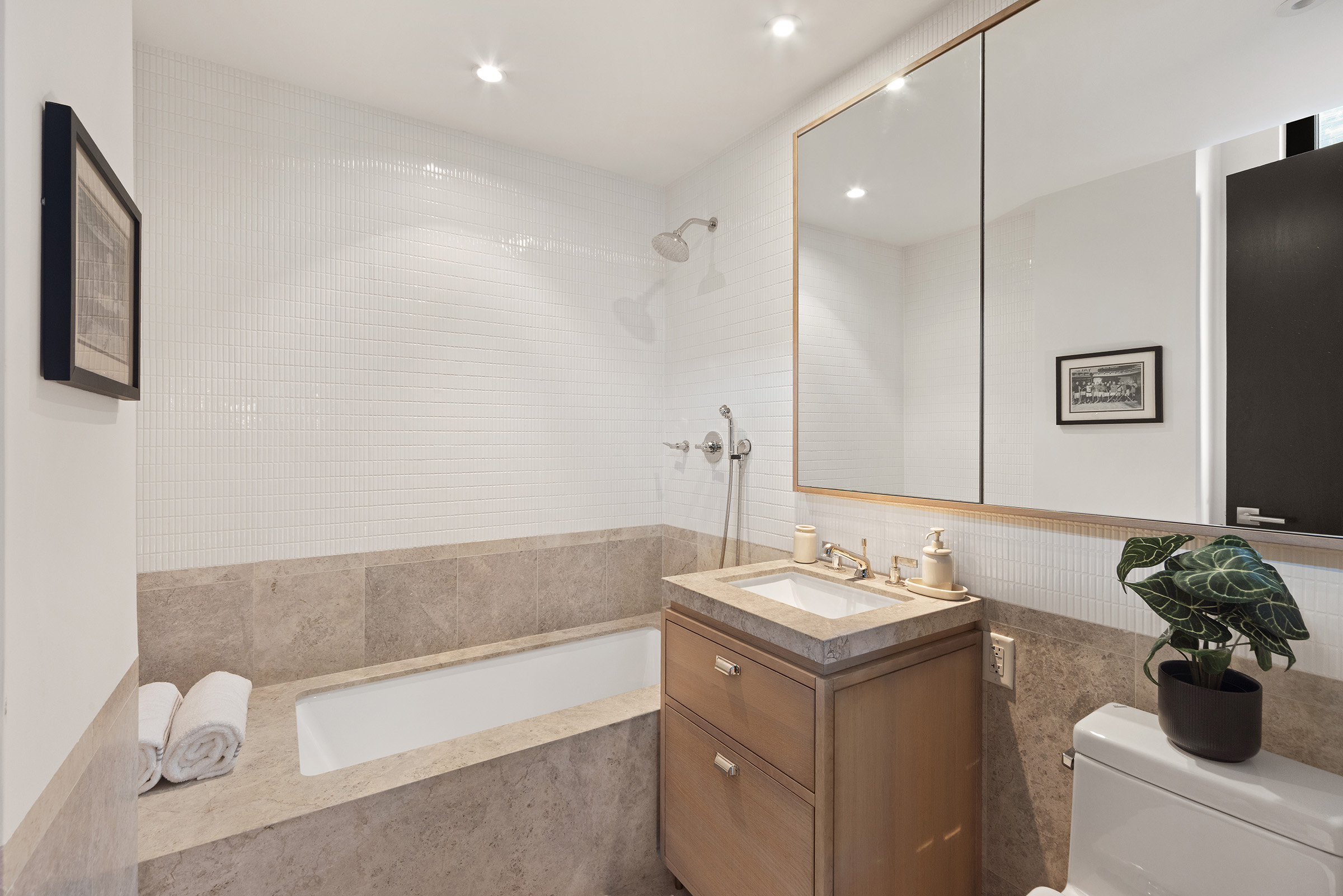 51 Jay Street, Unit 5J Brooklyn, NY 11201 - Photo 12 of 23 a bathroom with a granite countertop sink and a mirror