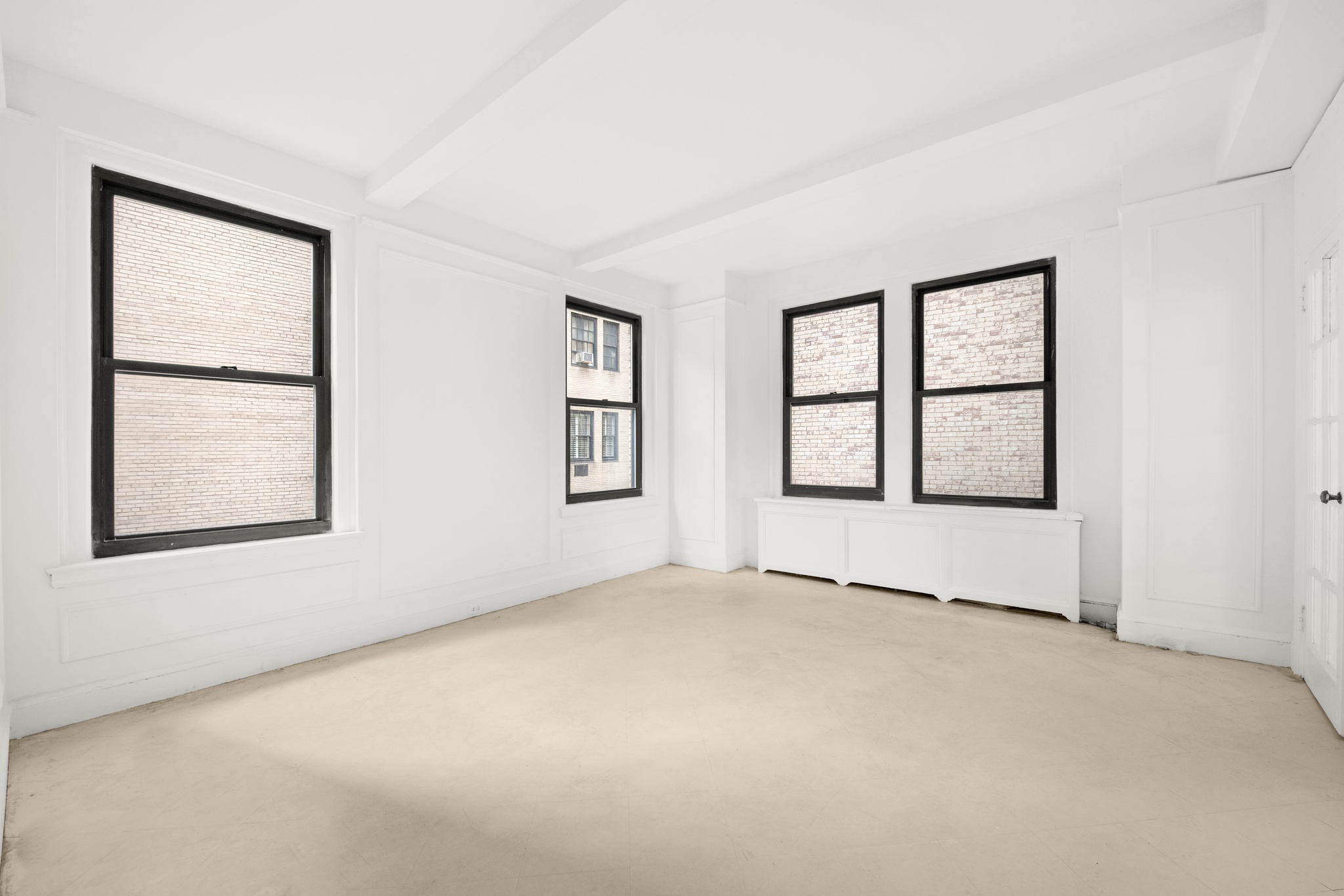 55 East 72nd Street, Unit 2NORTH Manhattan, NY 10021 - Photo 6 of 18 an empty room with windows and closet