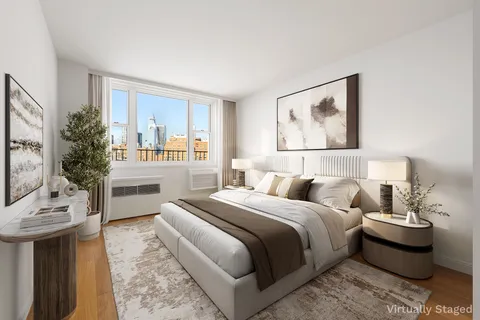 a bedroom with a bed and a couch