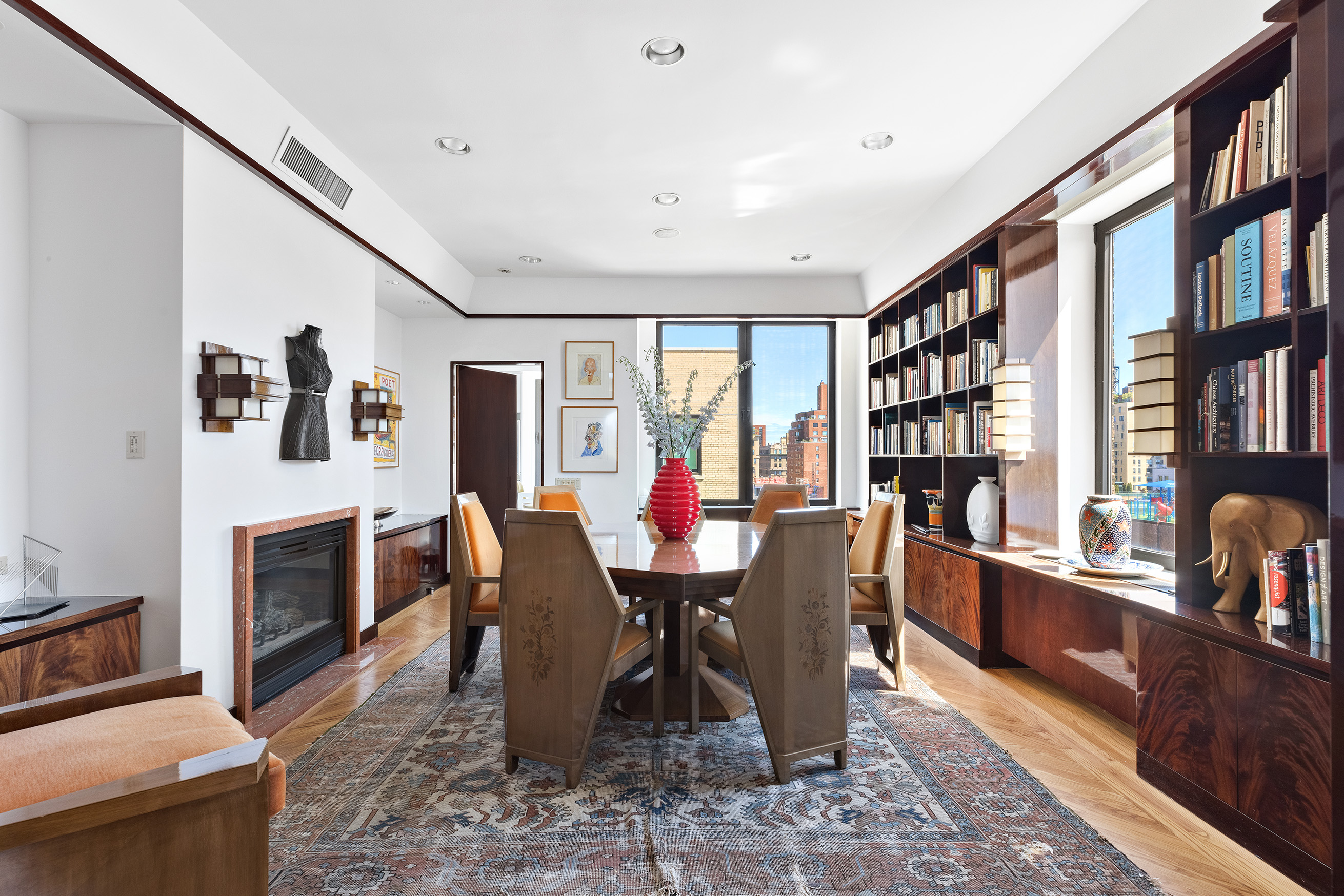 1115 5th Avenue, Unit 15A Manhattan, NY 10128 - Photo 12 of 27 a view of a dining room with furniture window and wooden floor