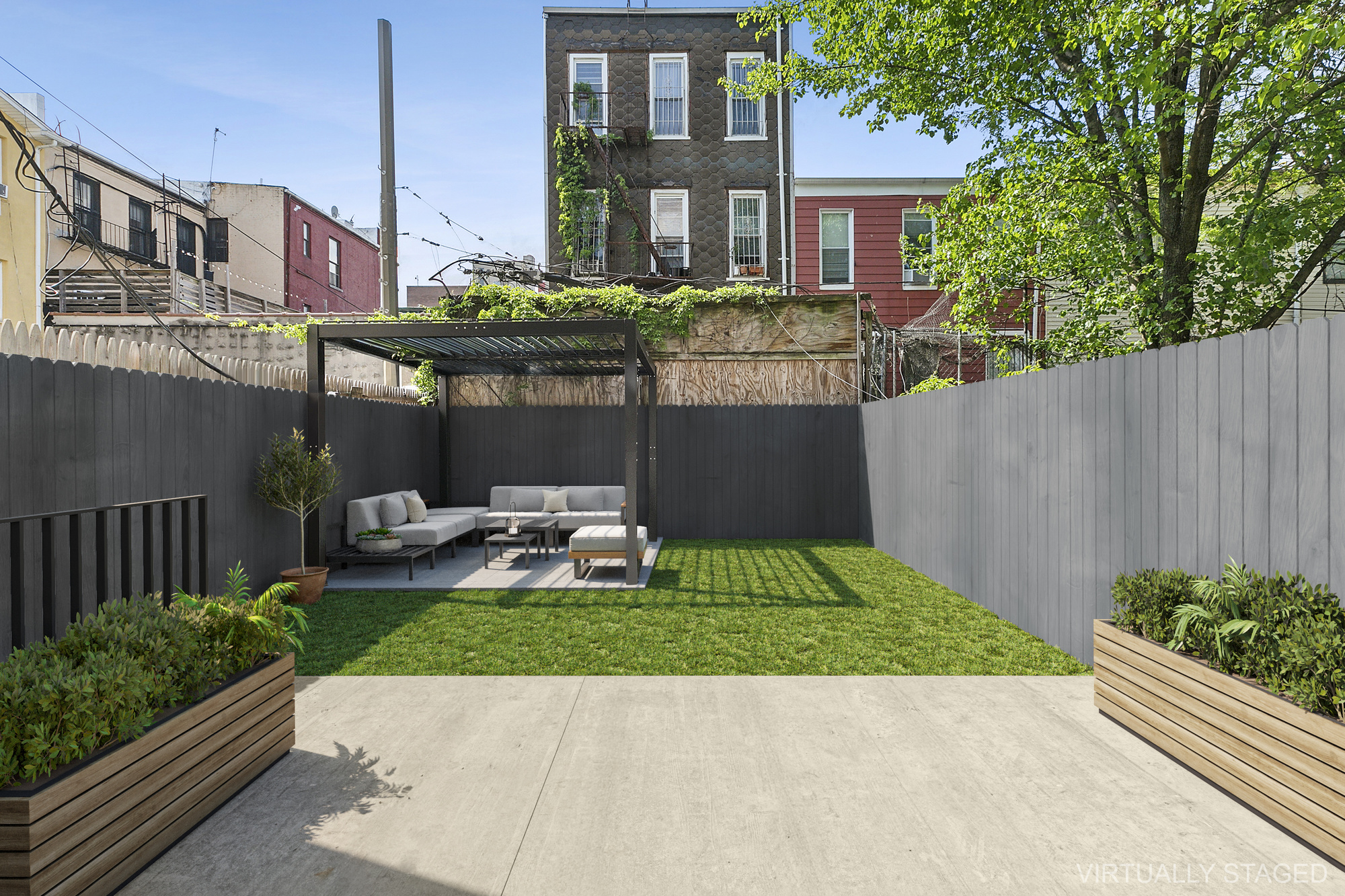 483 Hart Street, Unit 1 Brooklyn, NY 11221 - Photo 3 of 18 a view of a patio with table and chairs and wooden fence