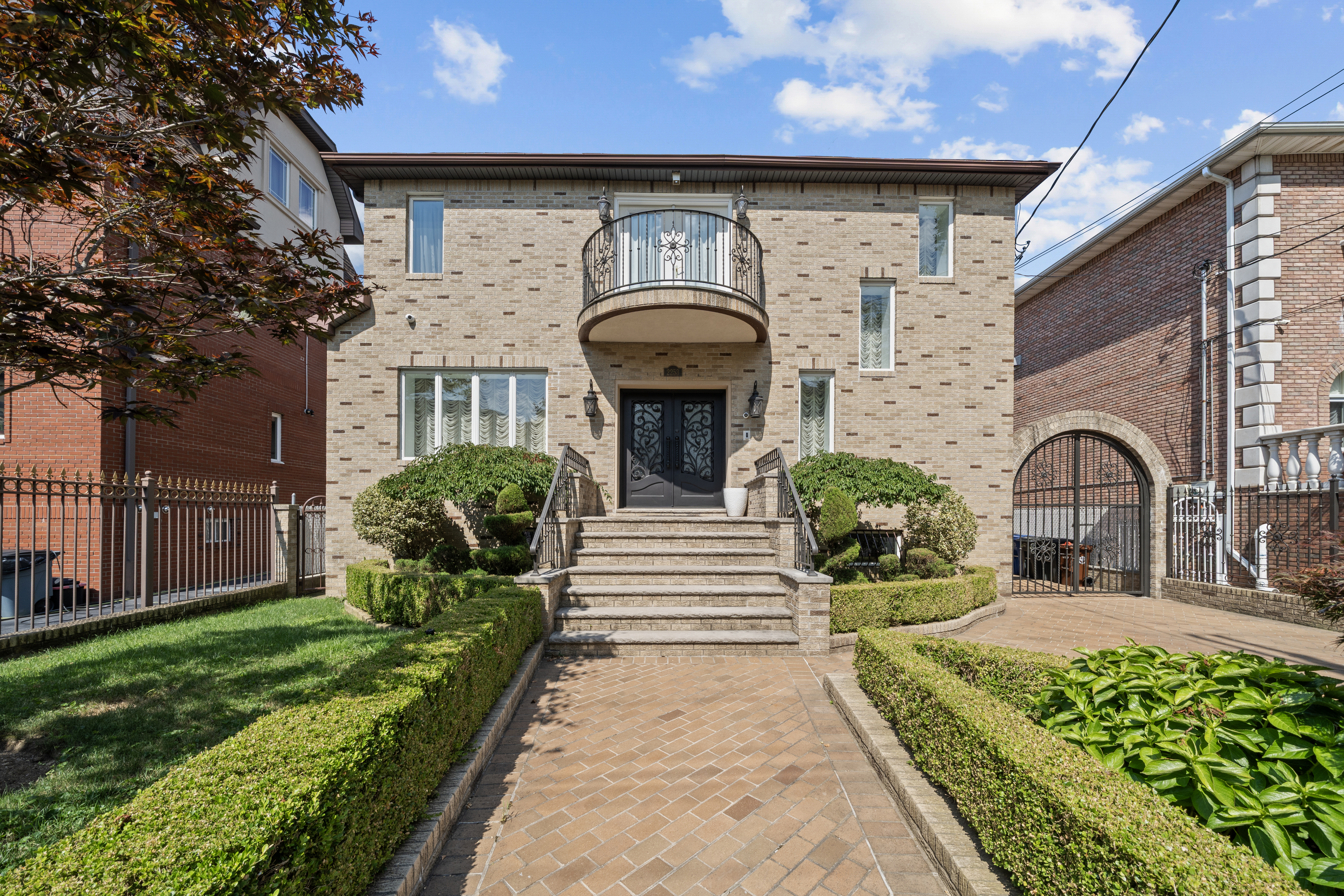 a front view of a house with garden