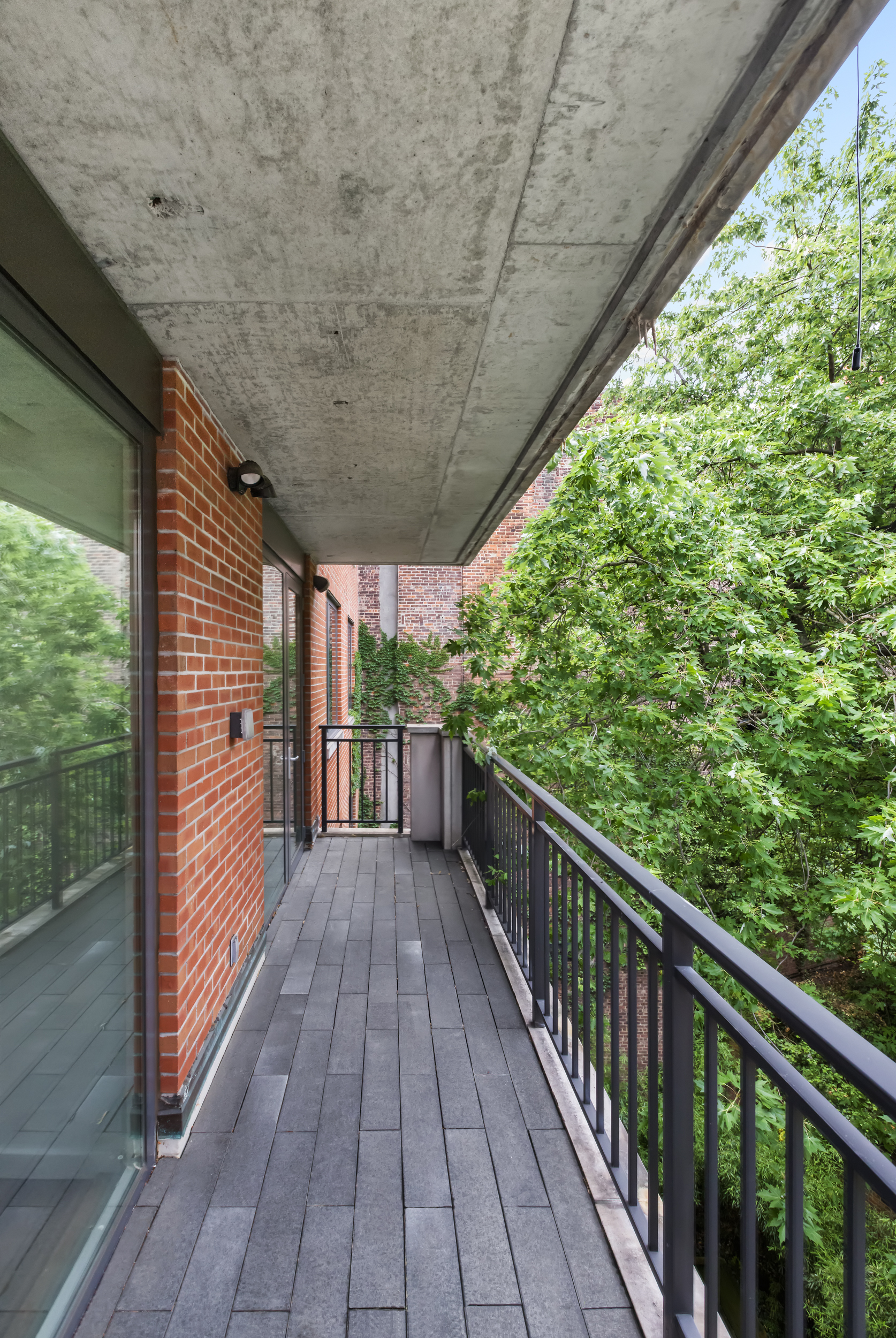 744 Greenwich Street, Unit 4 Manhattan, NY 10014 - Photo 25 of 34 a view of a balcony with wooden floor