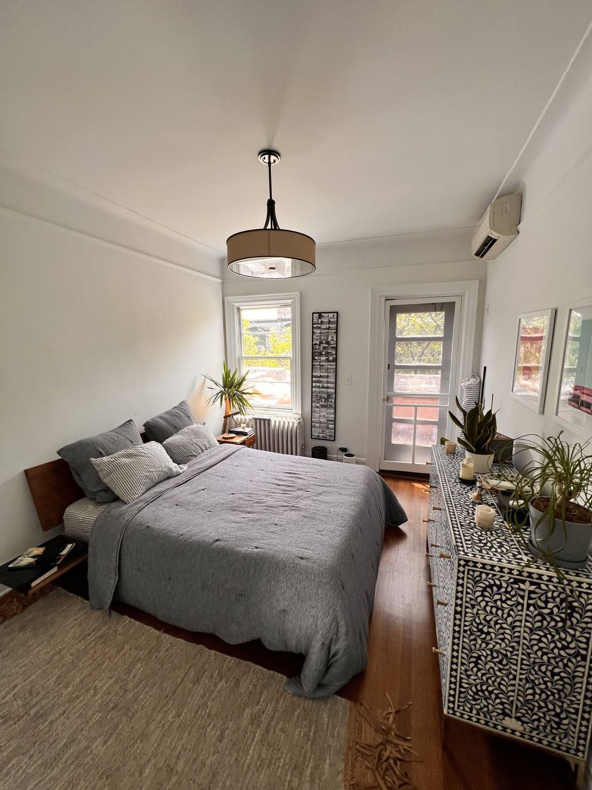 73 Perry Street, Unit 5 Manhattan, NY 10014 - Photo 7 of 10 a bedroom with bed couch and window