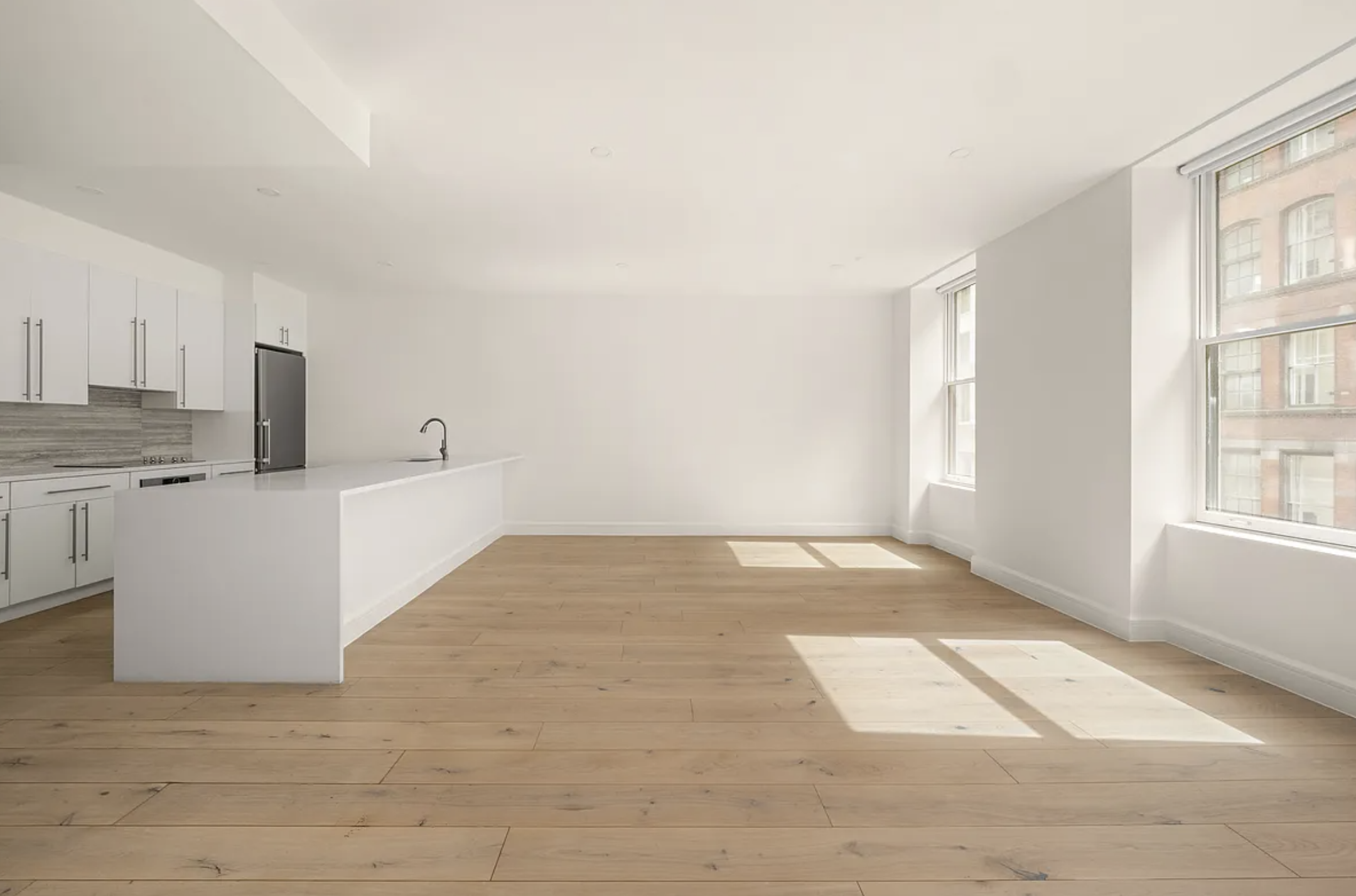 17 West 24th Street, Unit 4 Manhattan, NY 10010 - Photo 3 of 8 a view of an empty room with a window