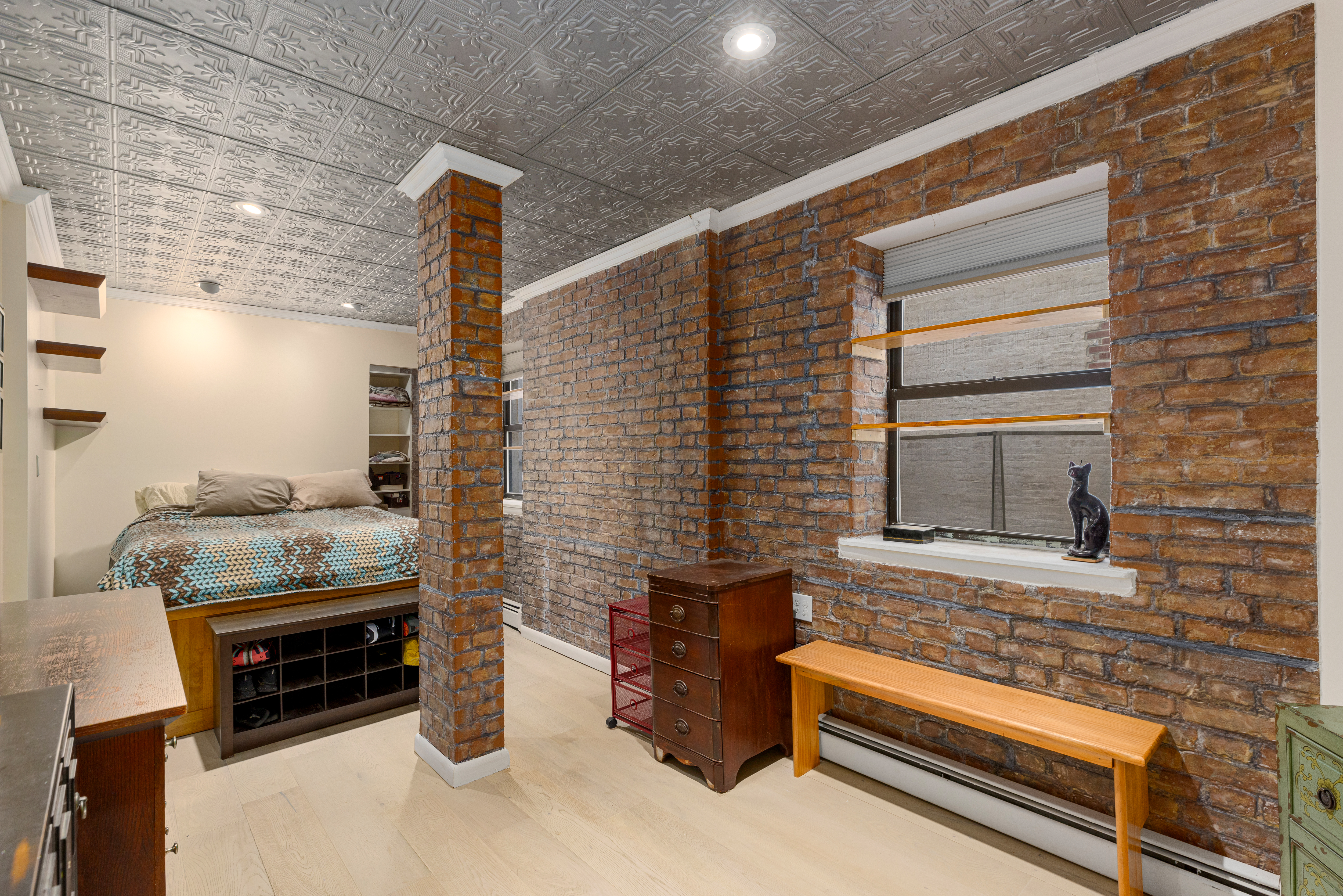 319 East 105th Street, Unit 2F Manhattan, NY 10029 - Photo 3 of 5 a backyard of a house with barbeque oven and outdoor seating